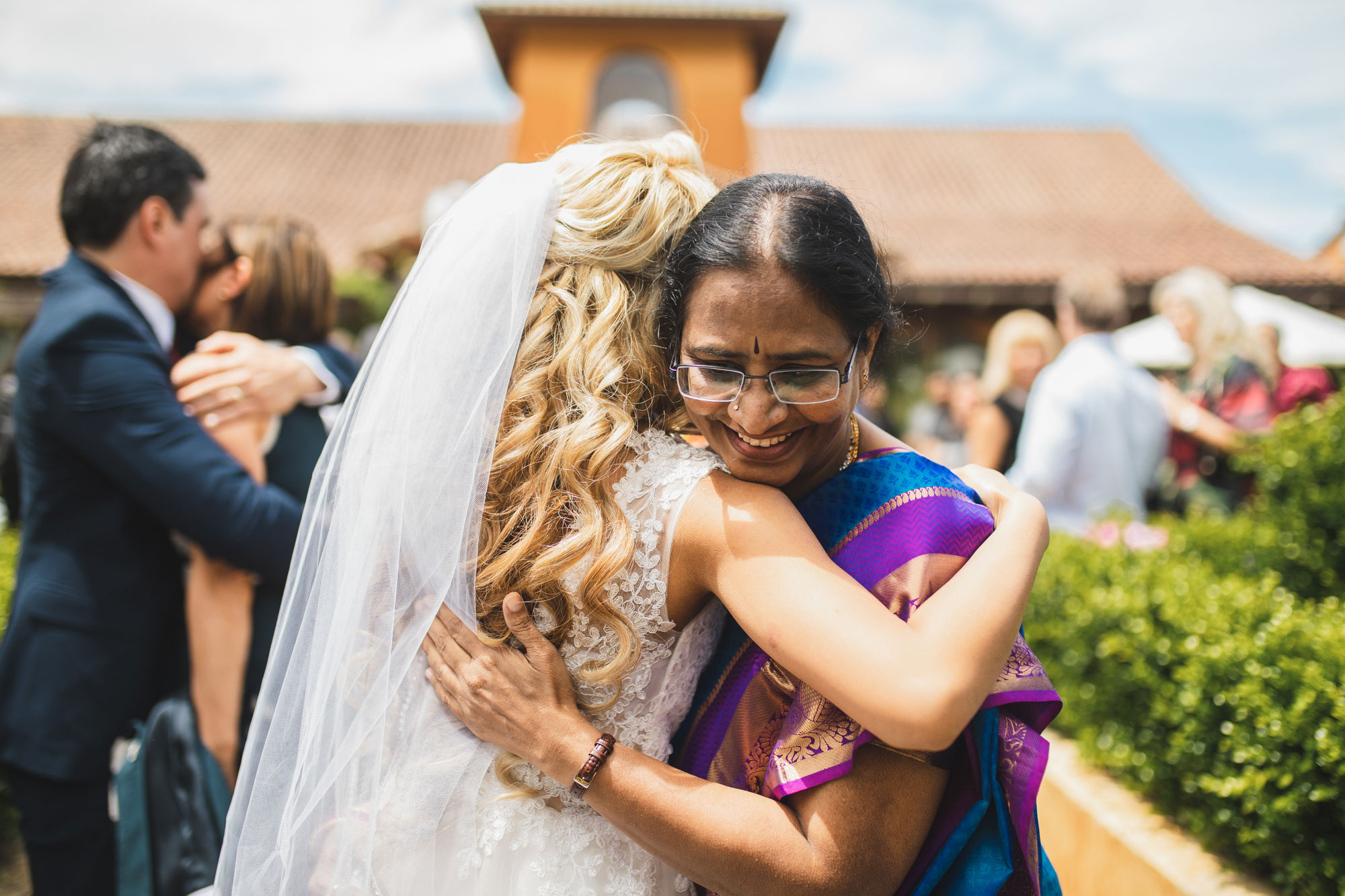 auckland wedding lady hugging bride