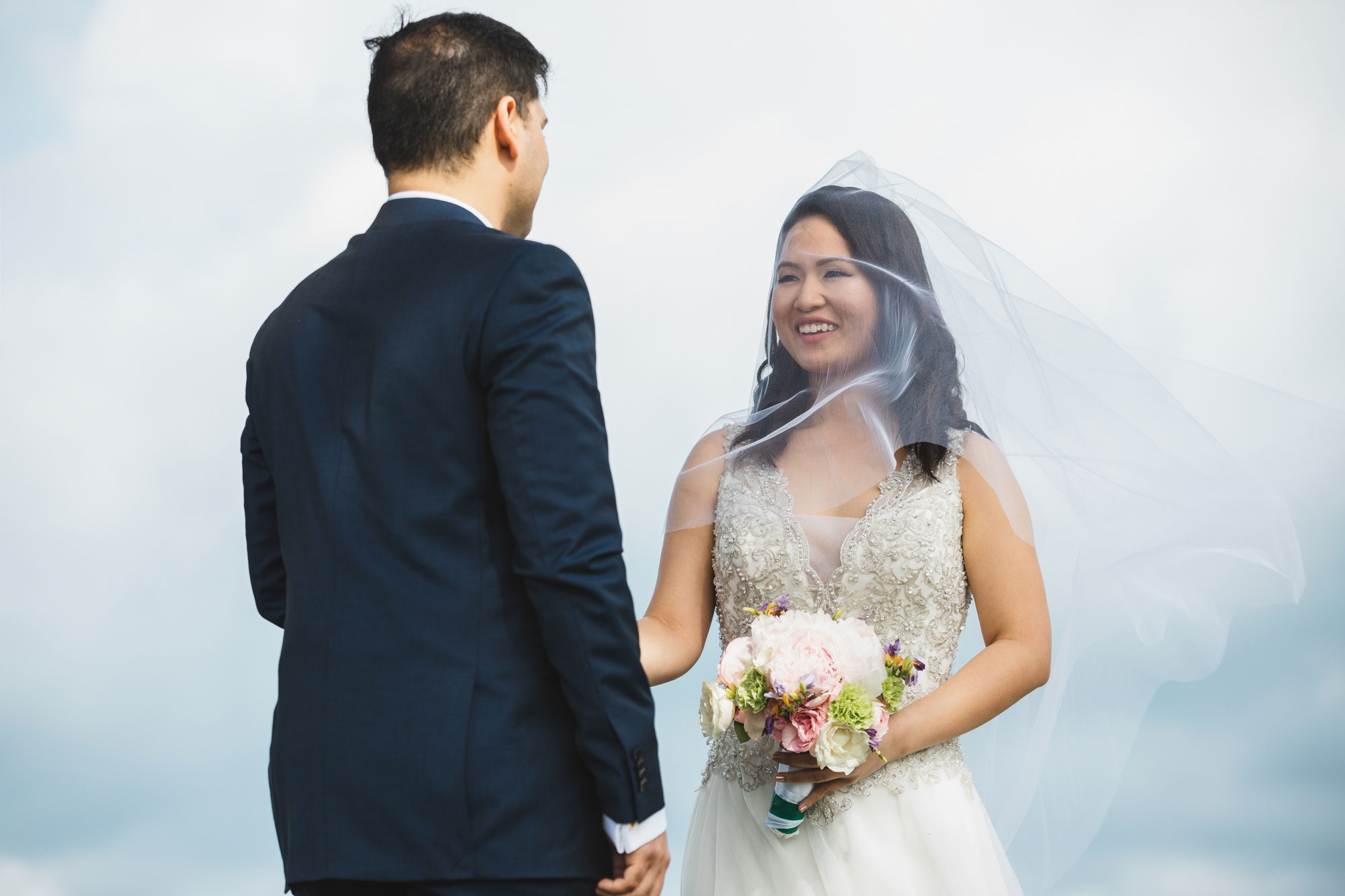 auckland wedding bride looking at groom