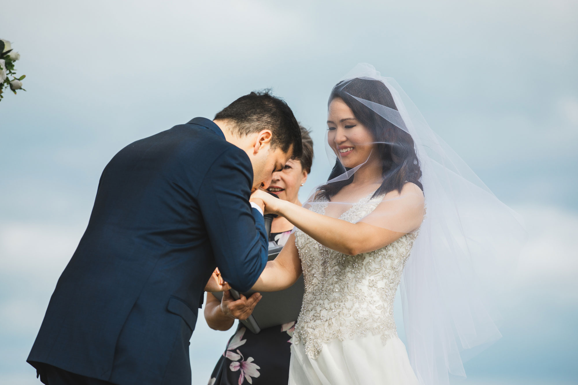 auckland wedding groom kissing bride