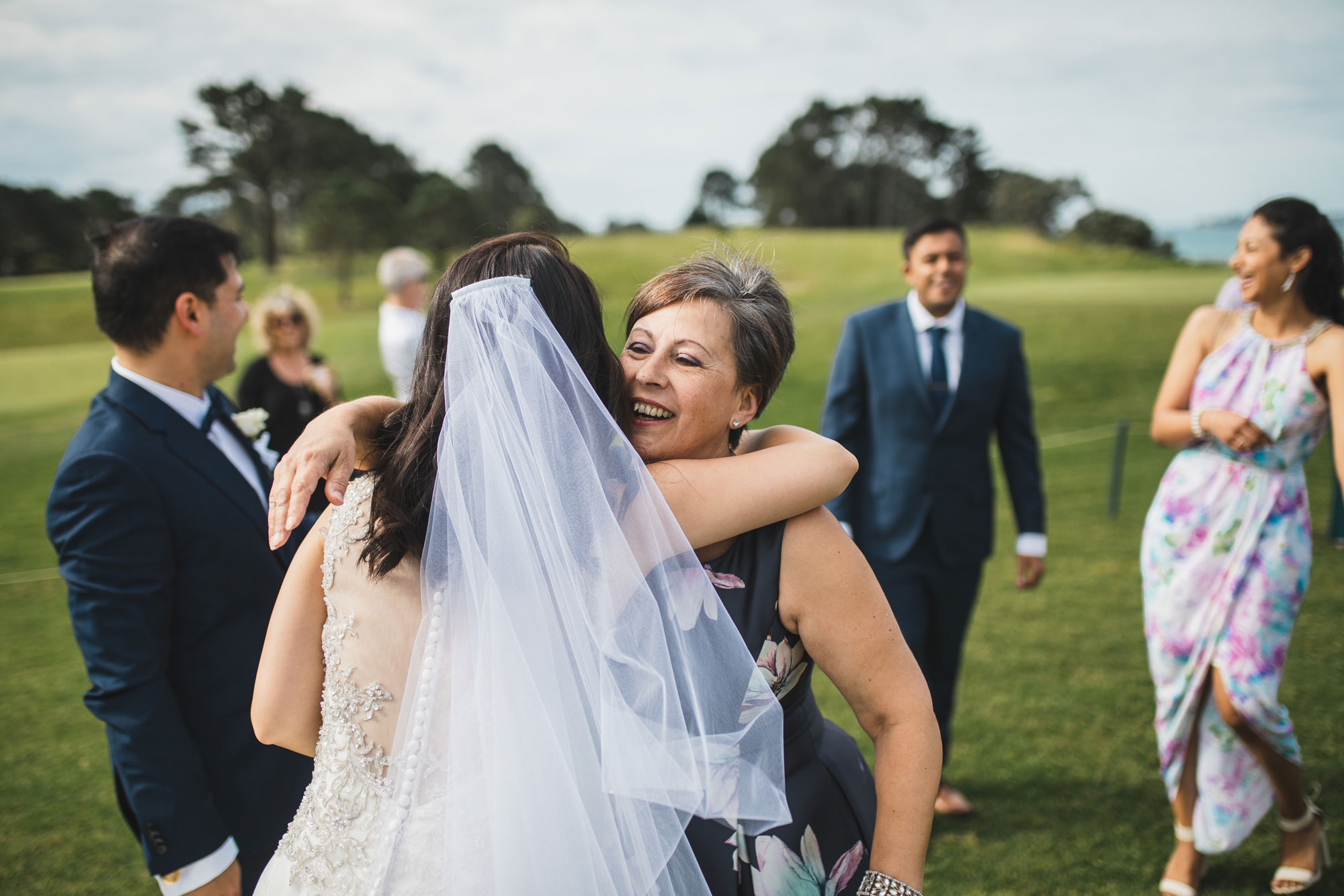auckland wedding celebrant hugging bride