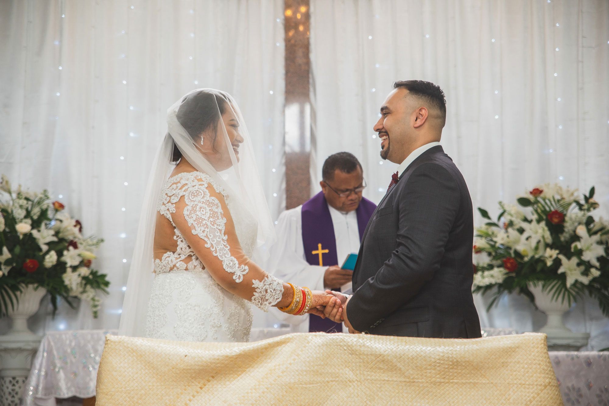 bride and groom smiling