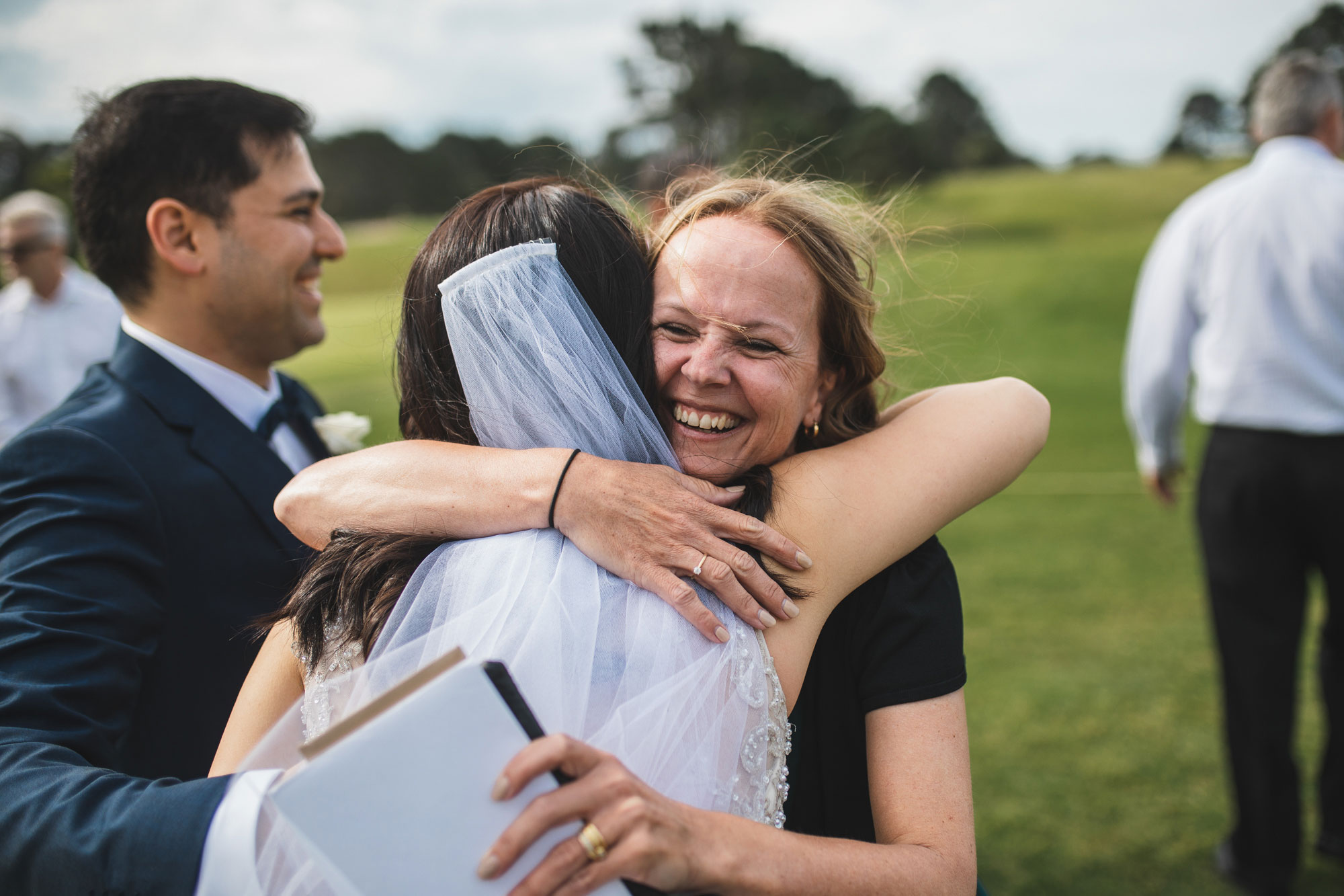 auckland wedding guest congratulating bride