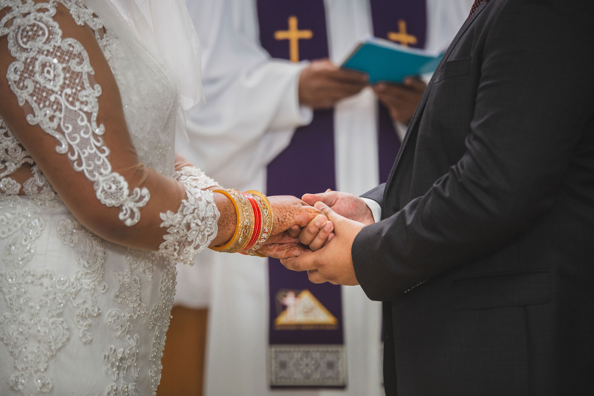 bride and groom holding hands