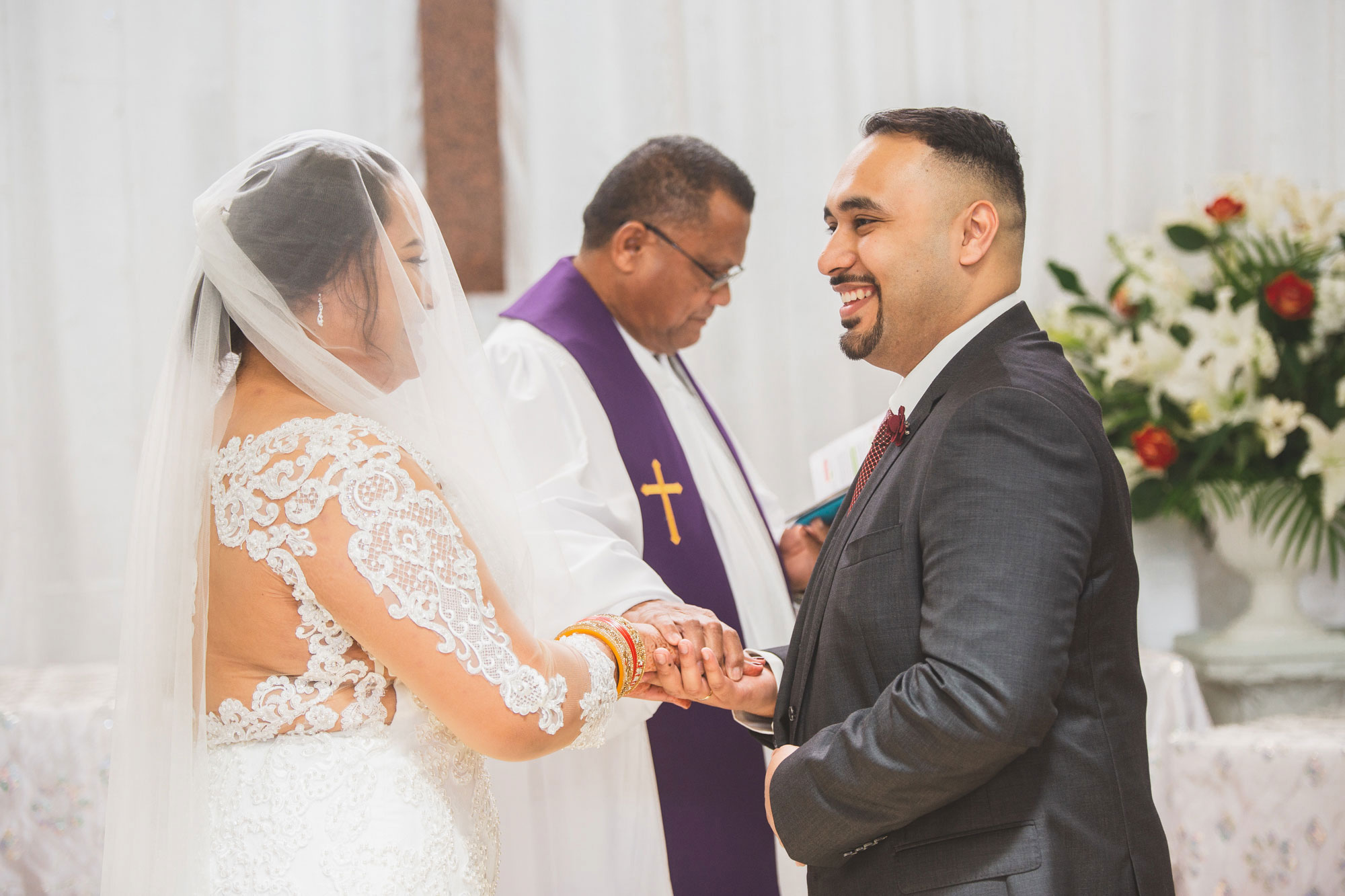 groom smiling at the bride