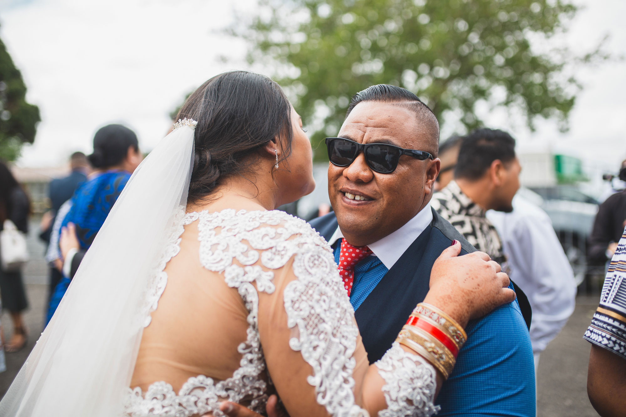 wedding guest hugging the bride