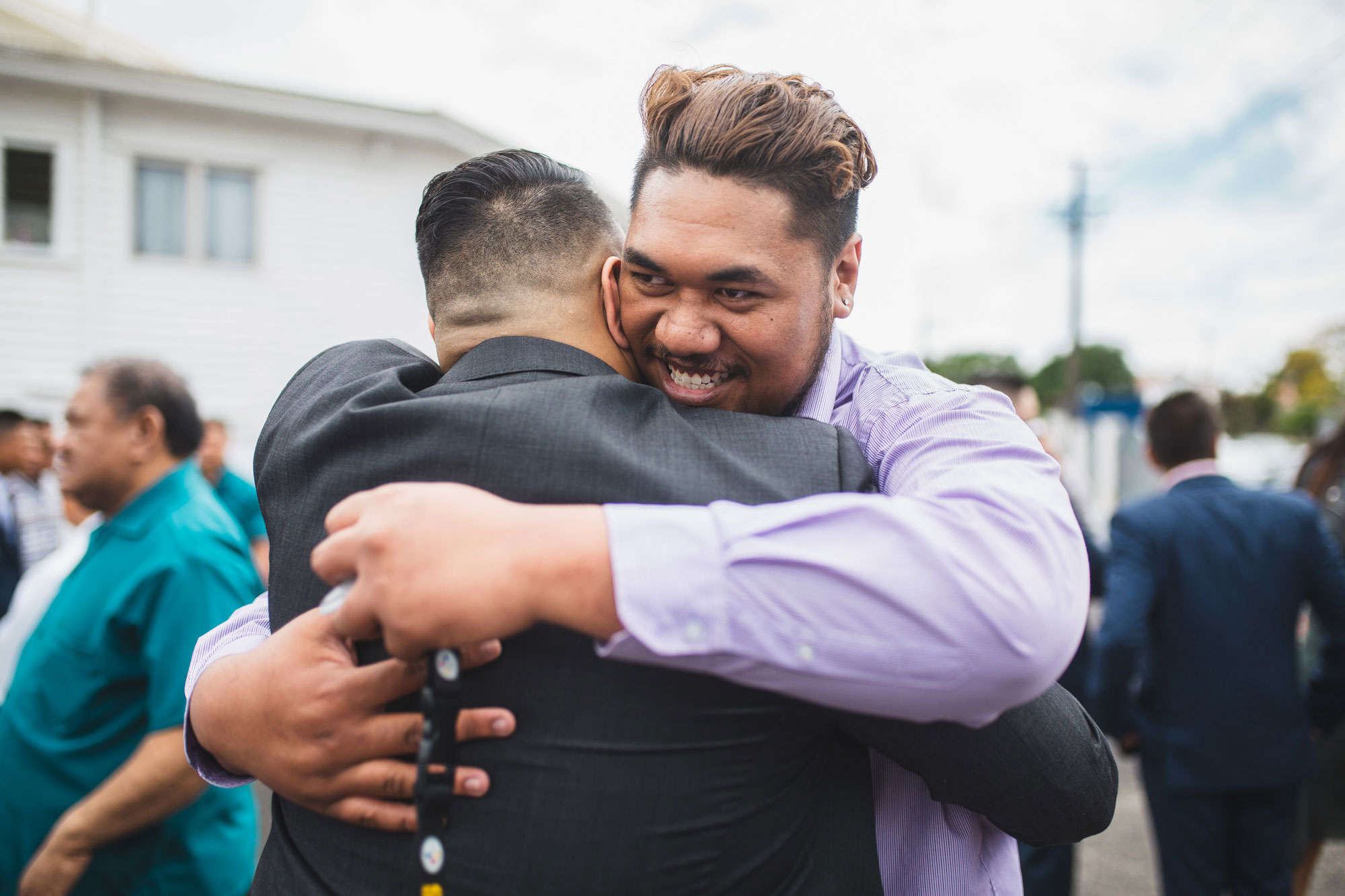 wedding guest hugging the groom