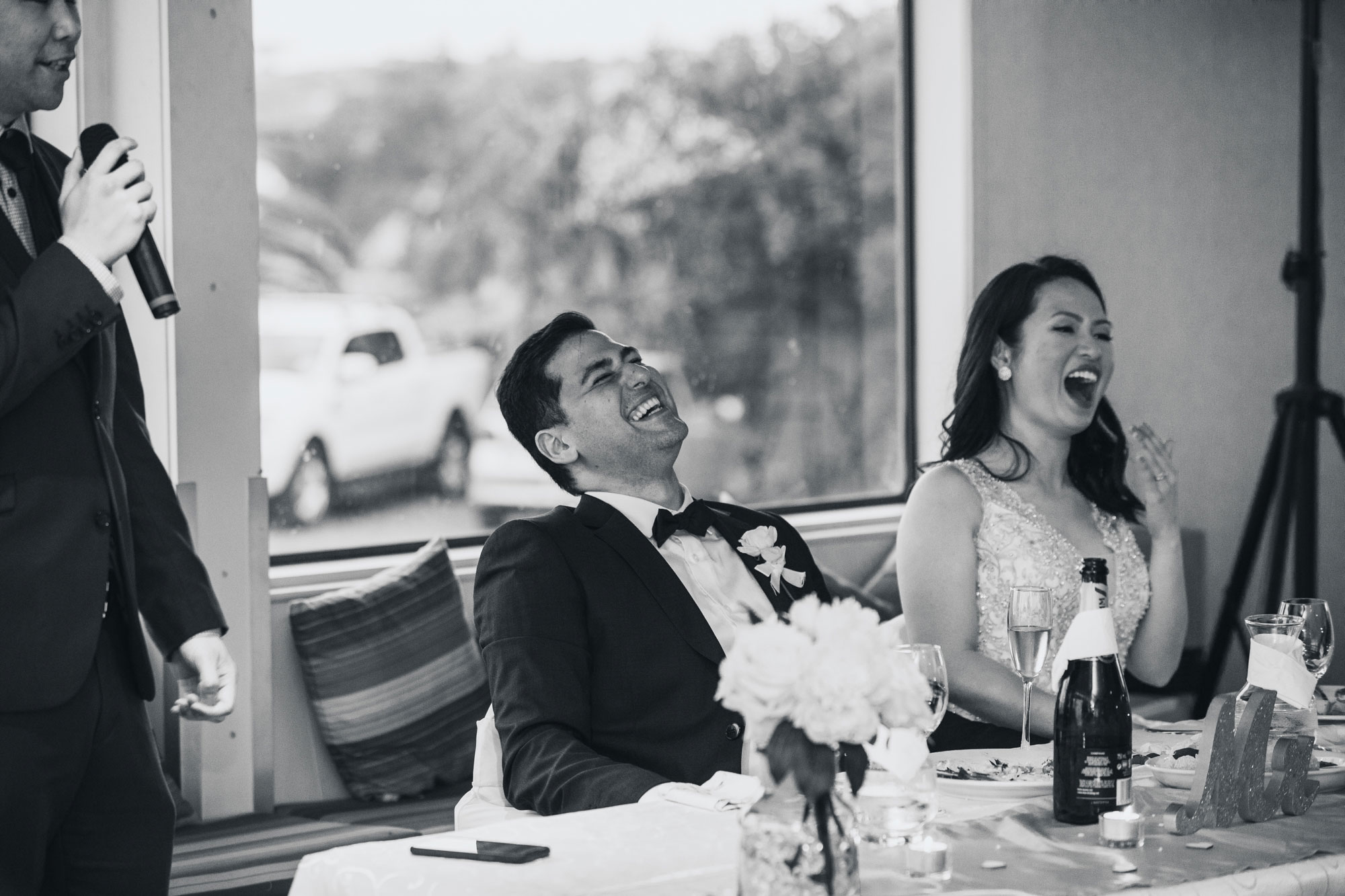 auckland wedding groom laughing at speech