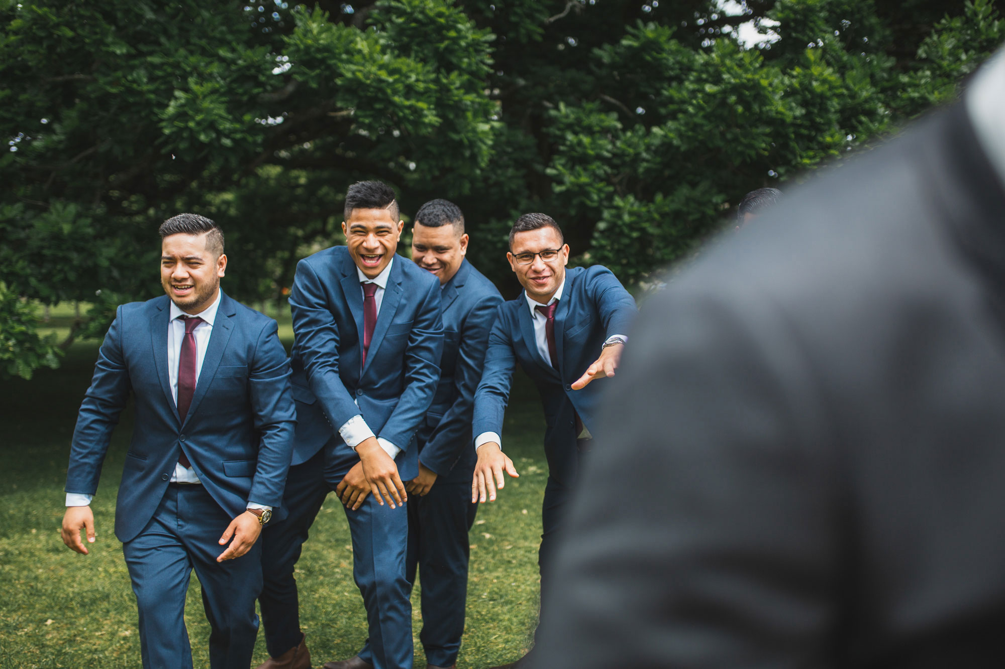 auckland wedding groomsmen having fun