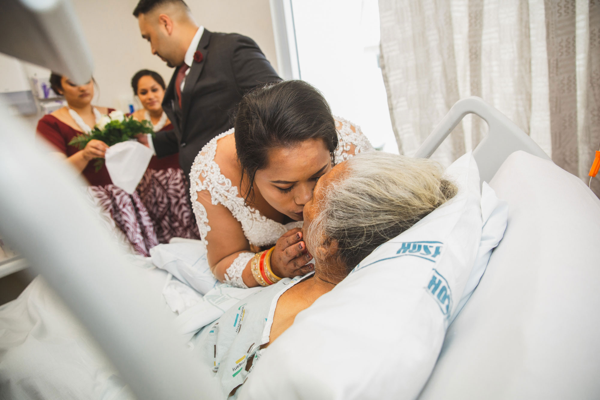 bride kissing grandma wedding
