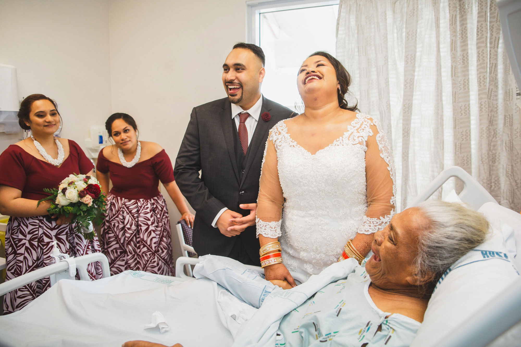 bride and groom laughing with grandma