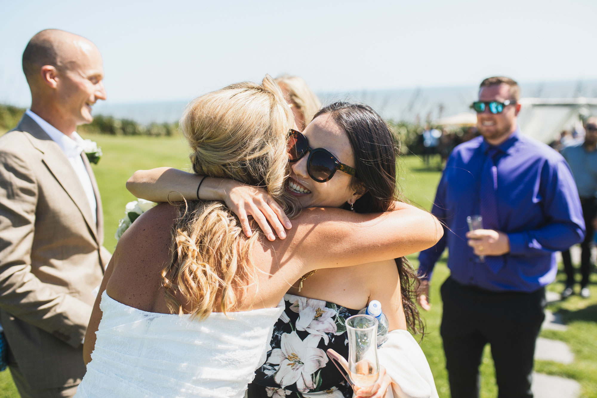 wedding guests hugging