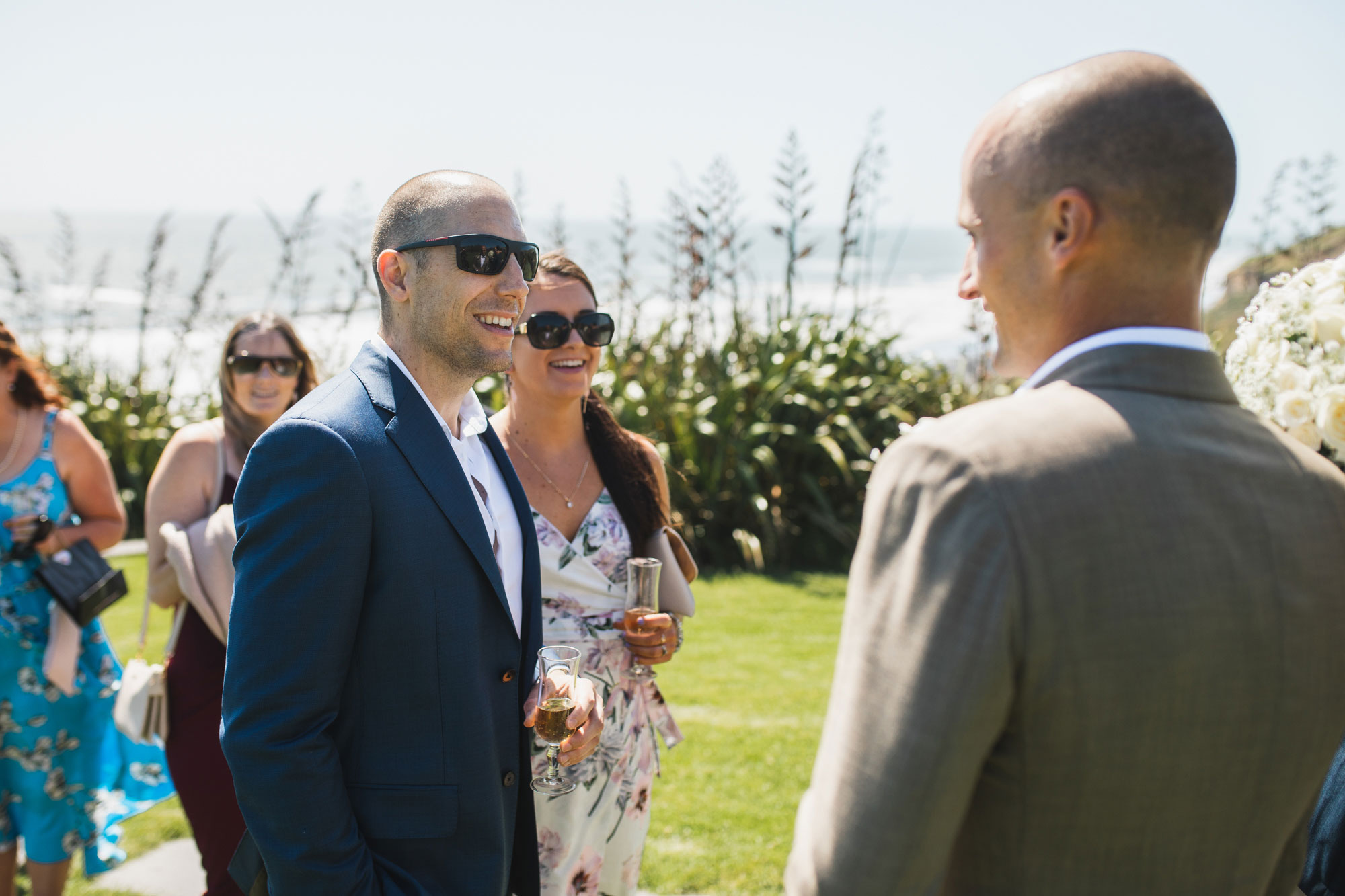 wedding guest congratulating the groom