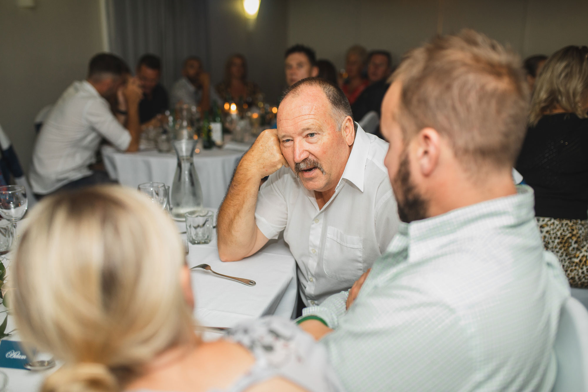 auckland castaways wedding reception guest talking