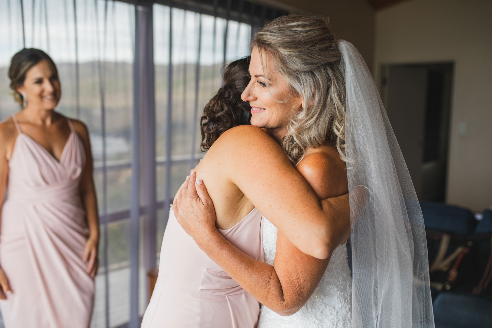 auckland castaways wedding bride hug