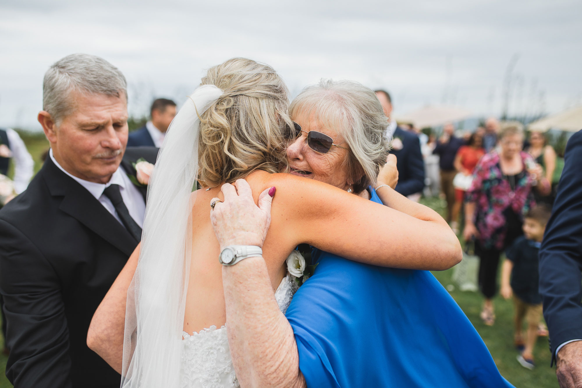 auckland castaways wedding guests hugging