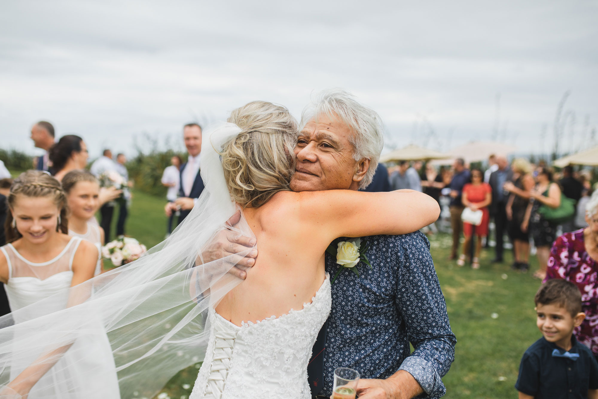 auckland castaways wedding father hugging bride