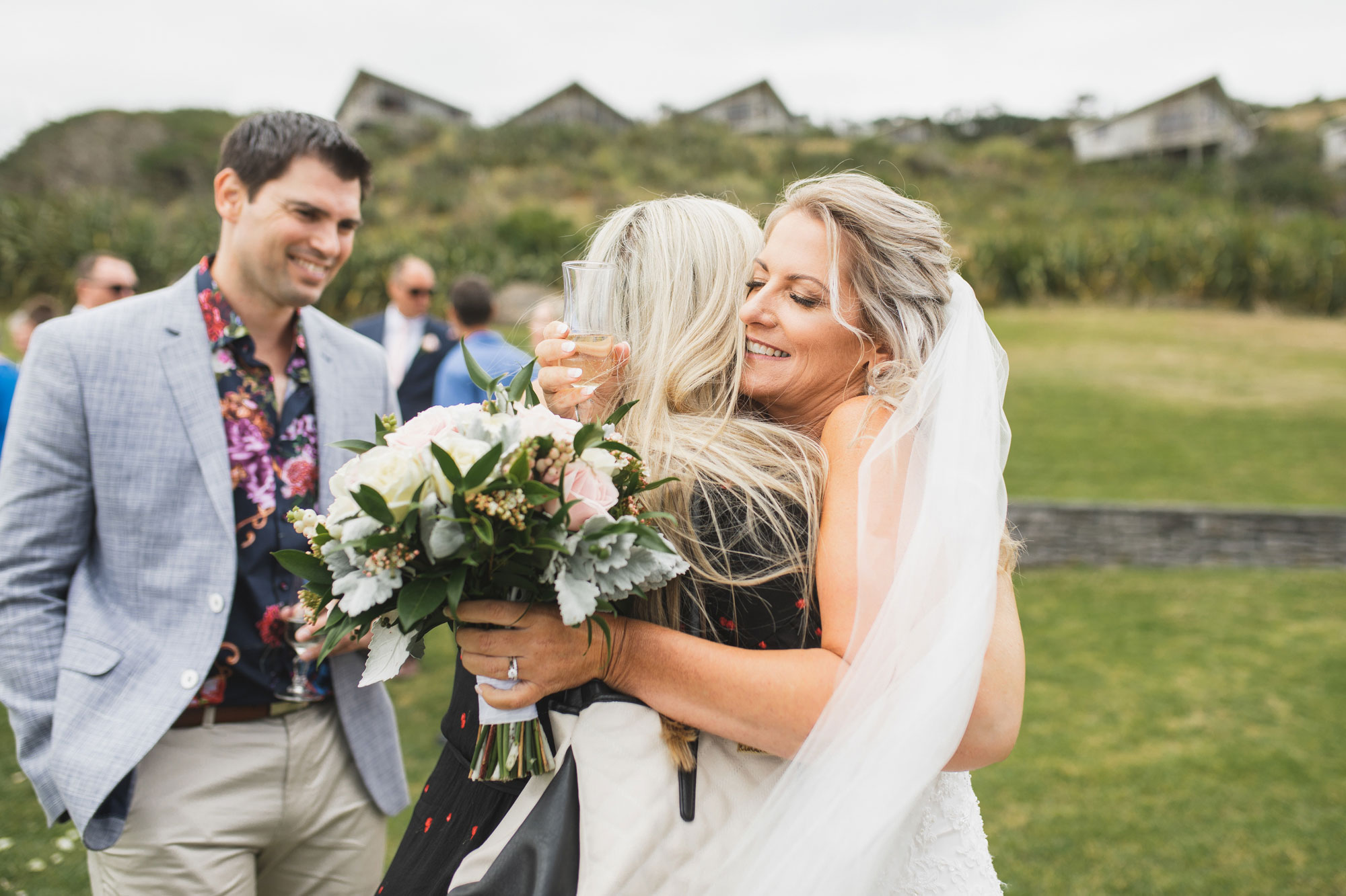 auckland castaways wedding bride hug