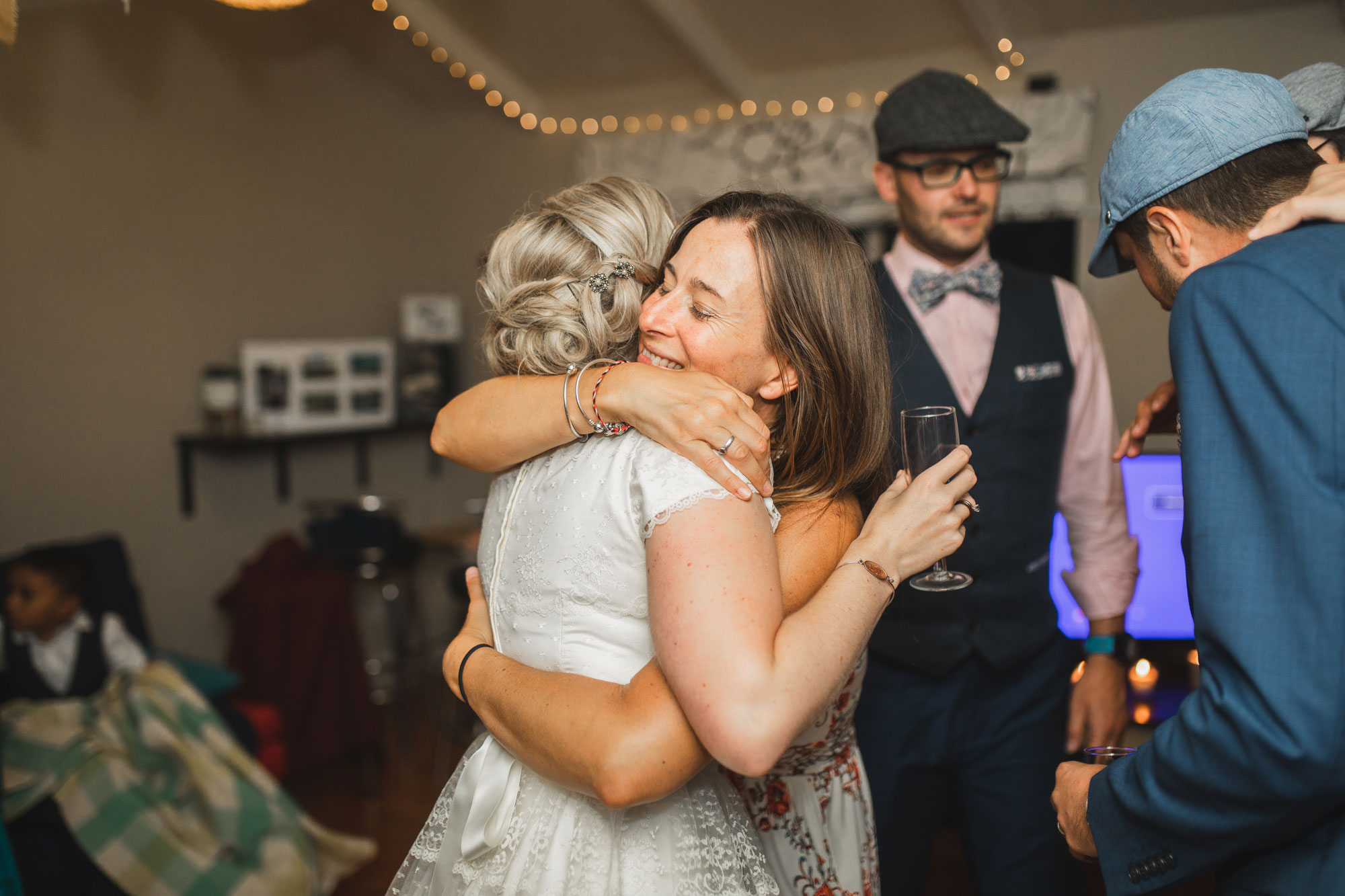 christchurch wedding guests hugging on dance floor