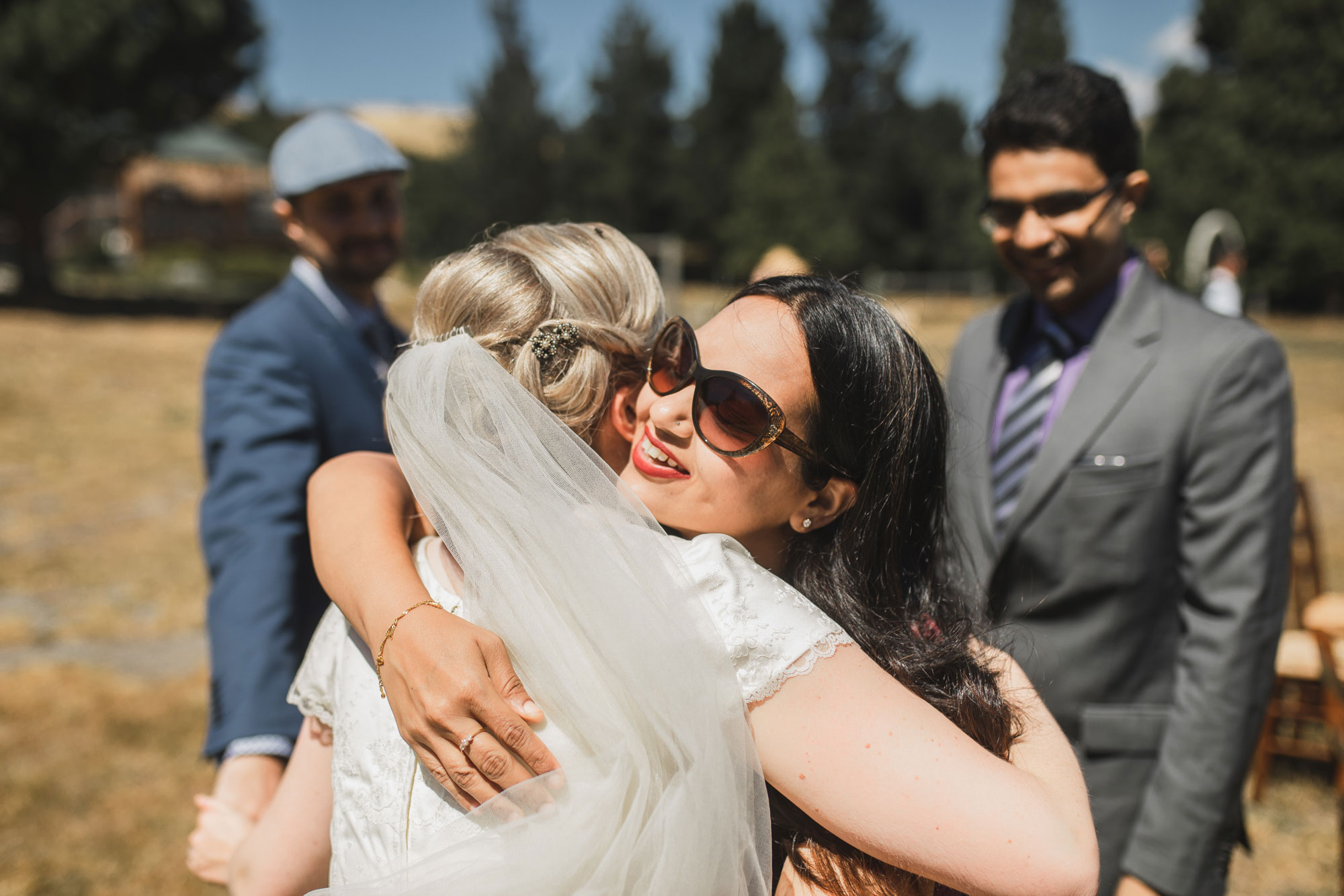 christchurch wedding guests hug bride