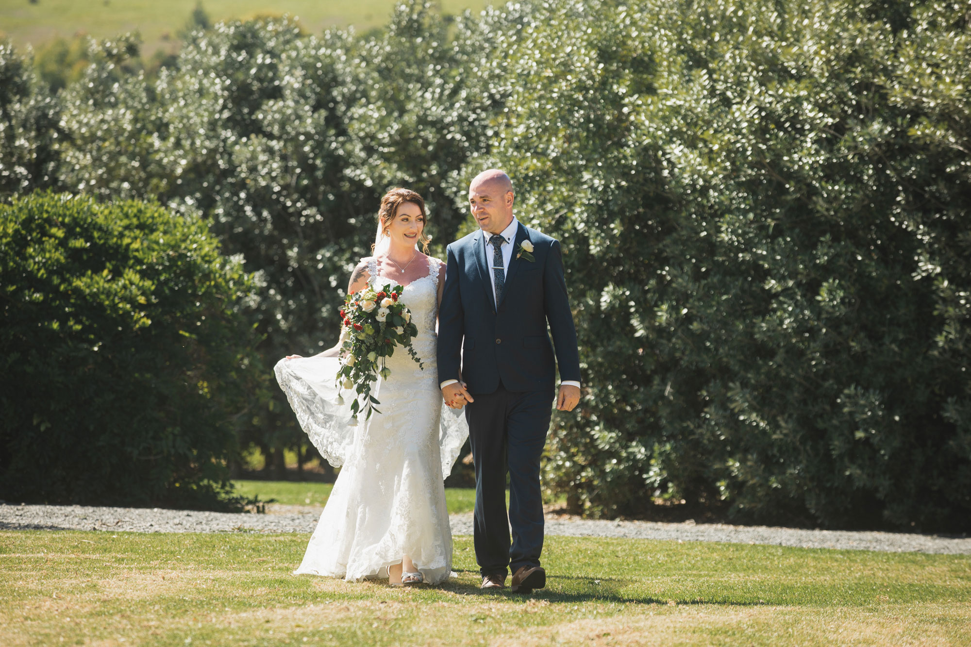 auckland tawharanui lodge wedding bride walking down aisle