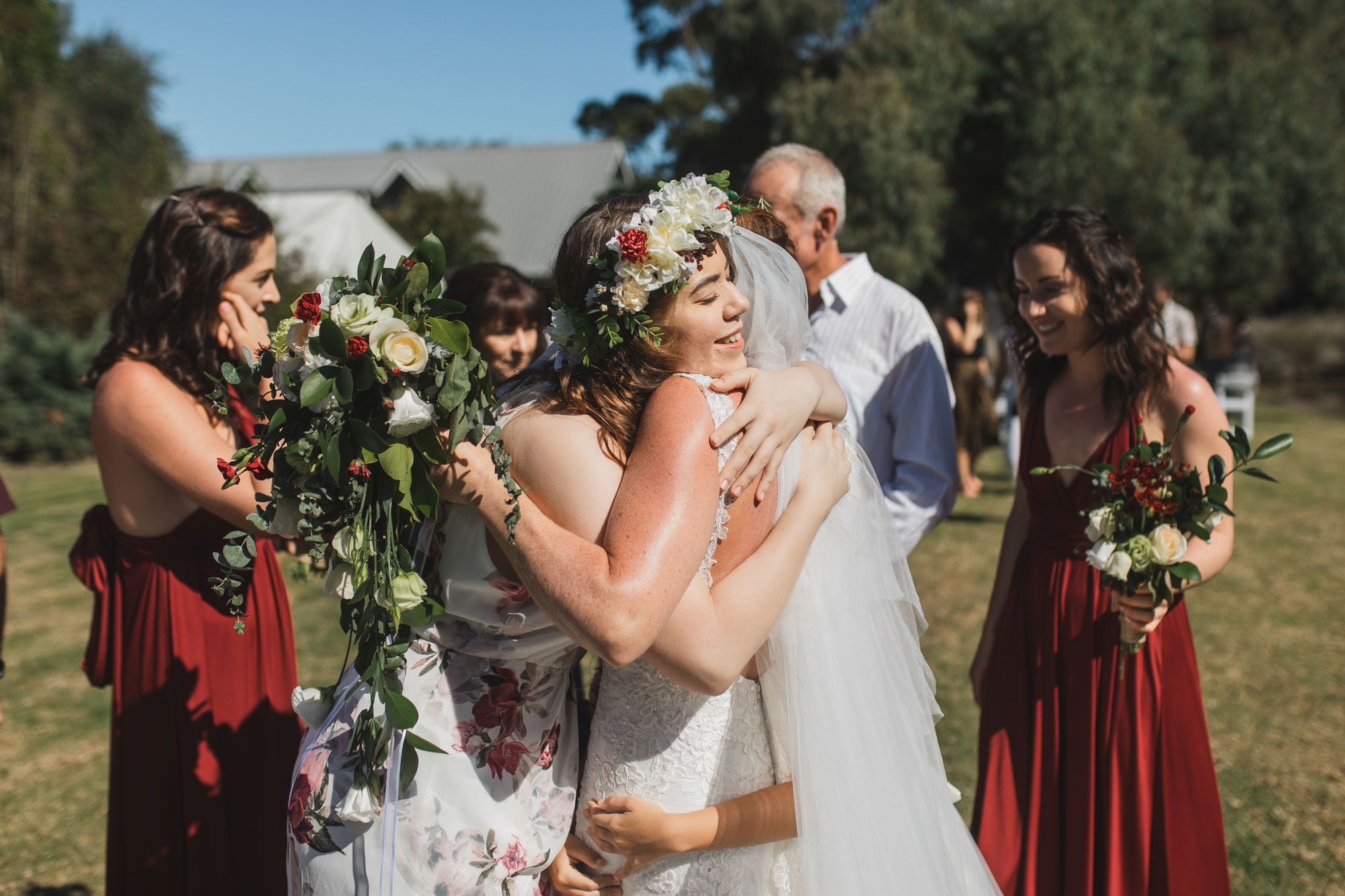 auckland tawharanui lodge wedding family hugging