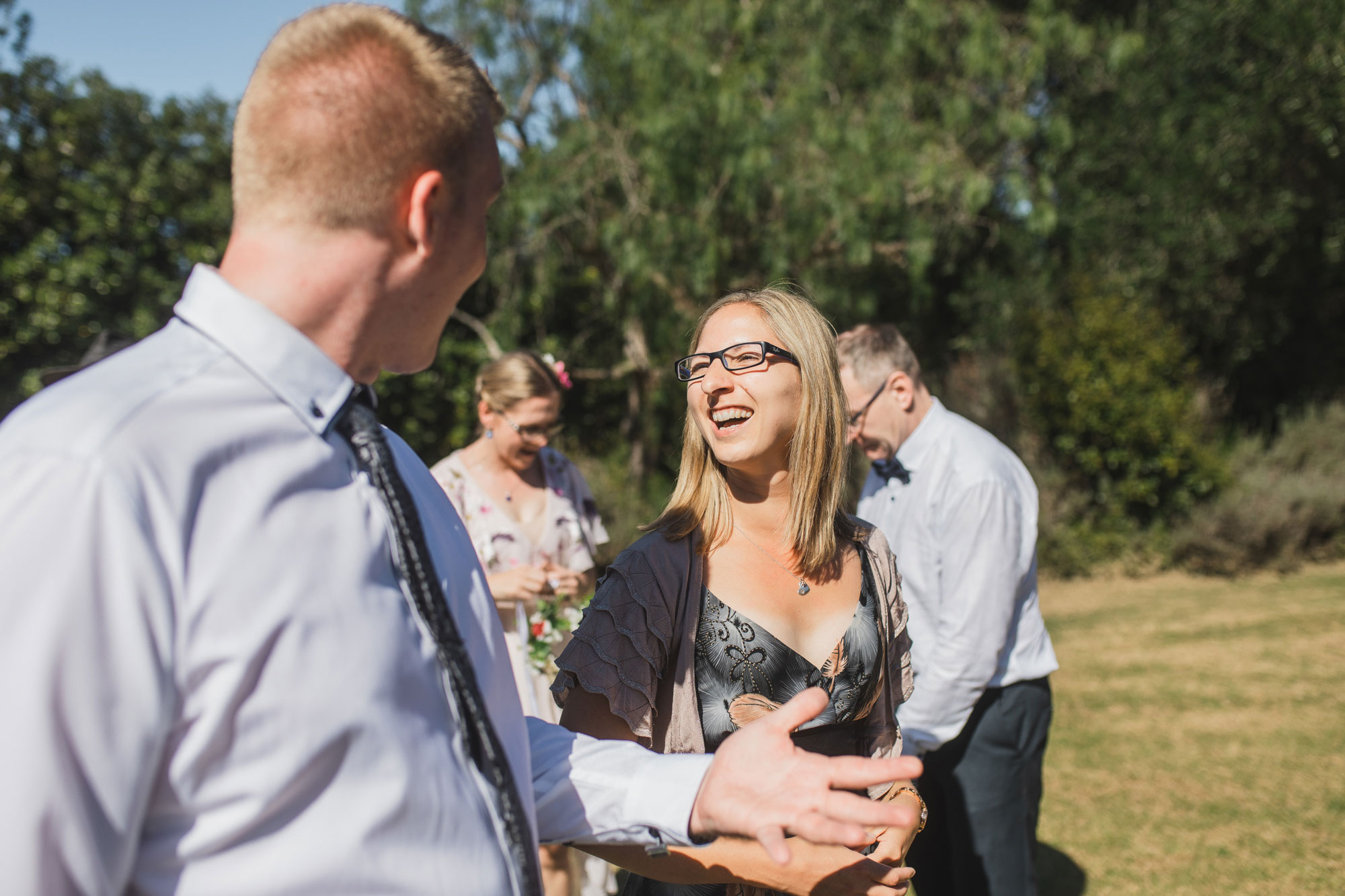 auckland tawharanui lodge wedding guests laughing