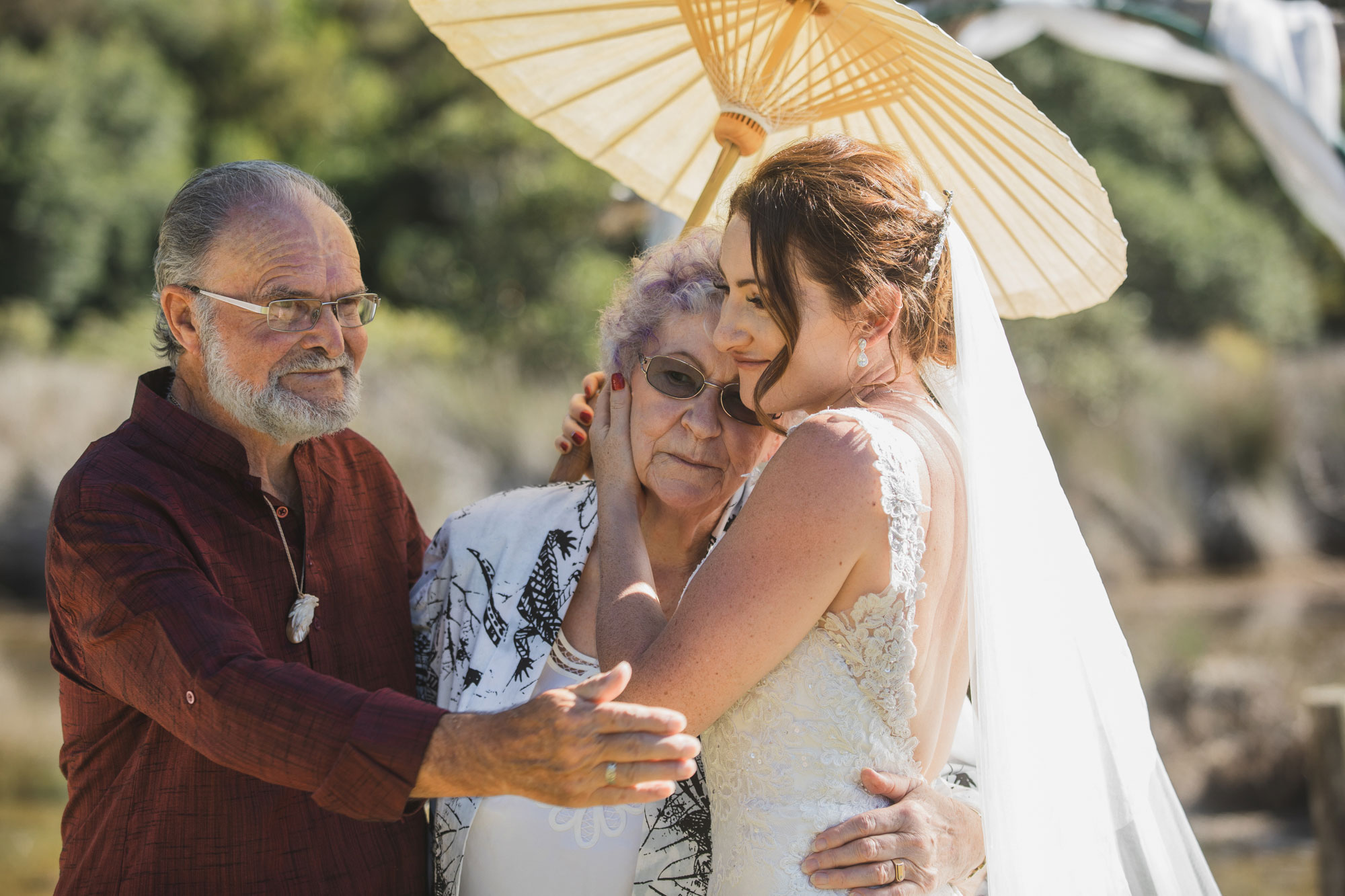 auckland tawharanui lodge wedding bride hugging grandma