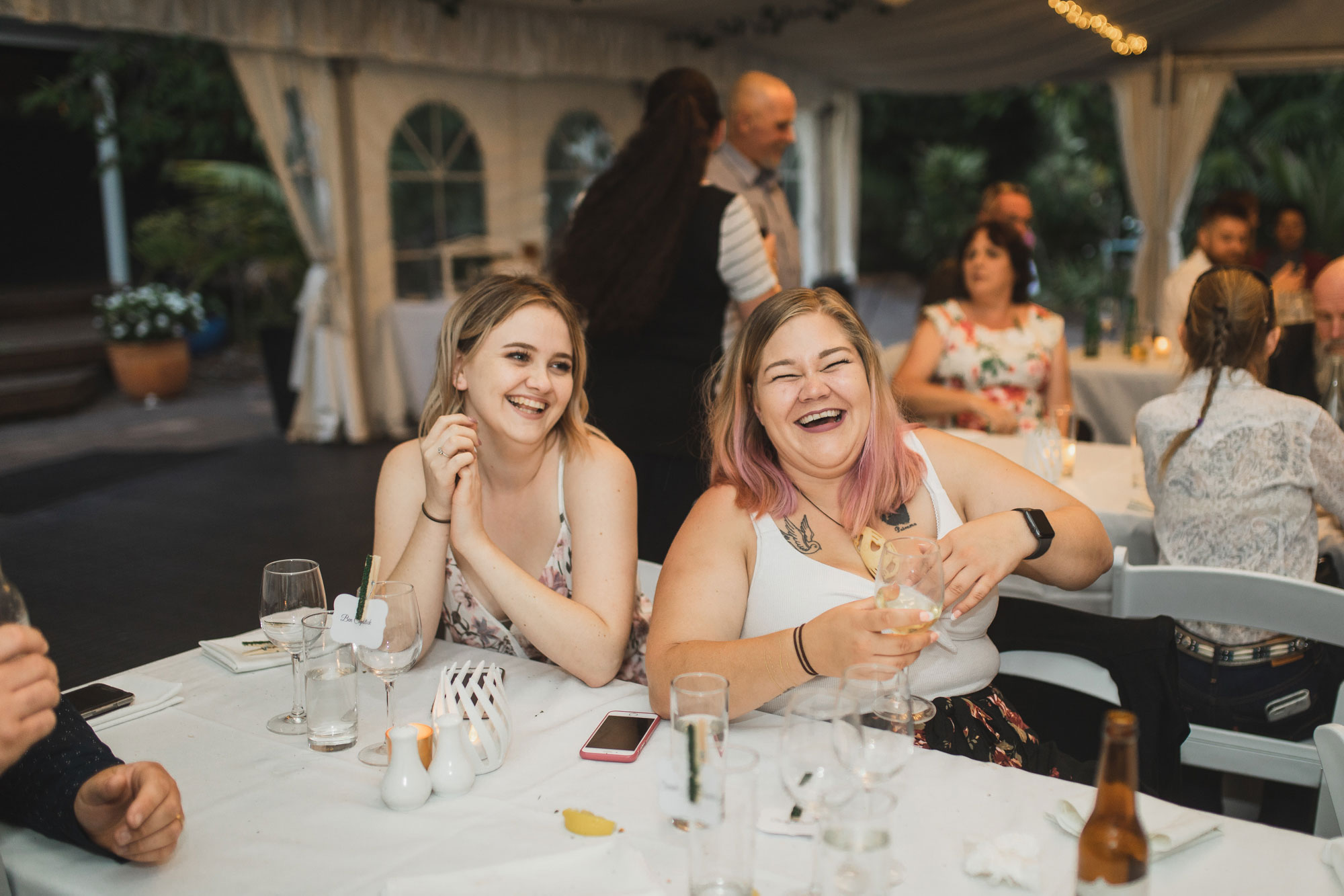 auckland tawharanui lodge wedding guests having a laugh