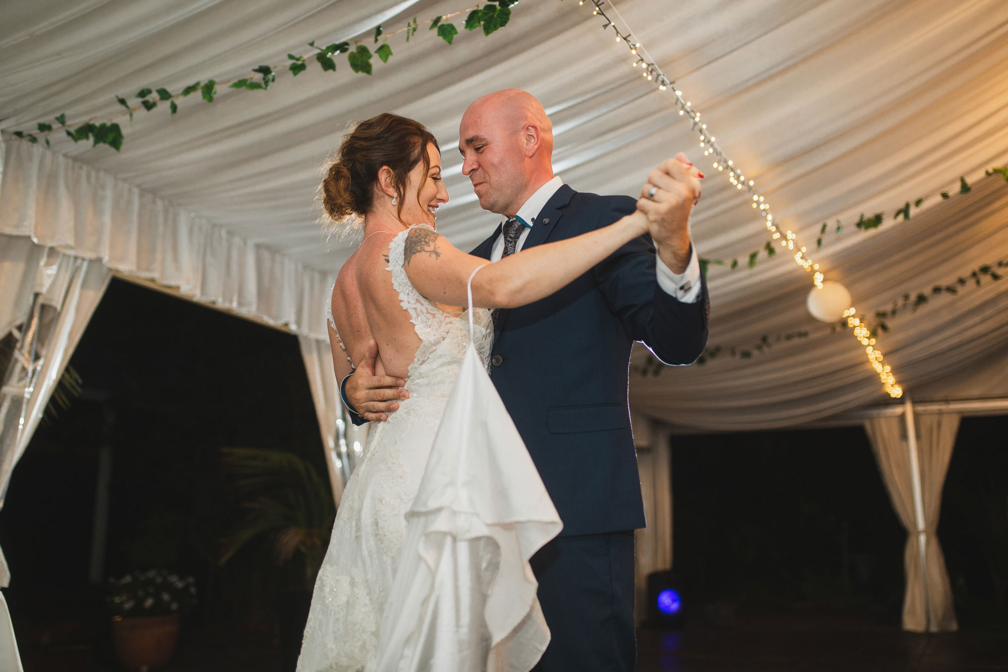 auckland tawharanui lodge wedding bride and groom dancing