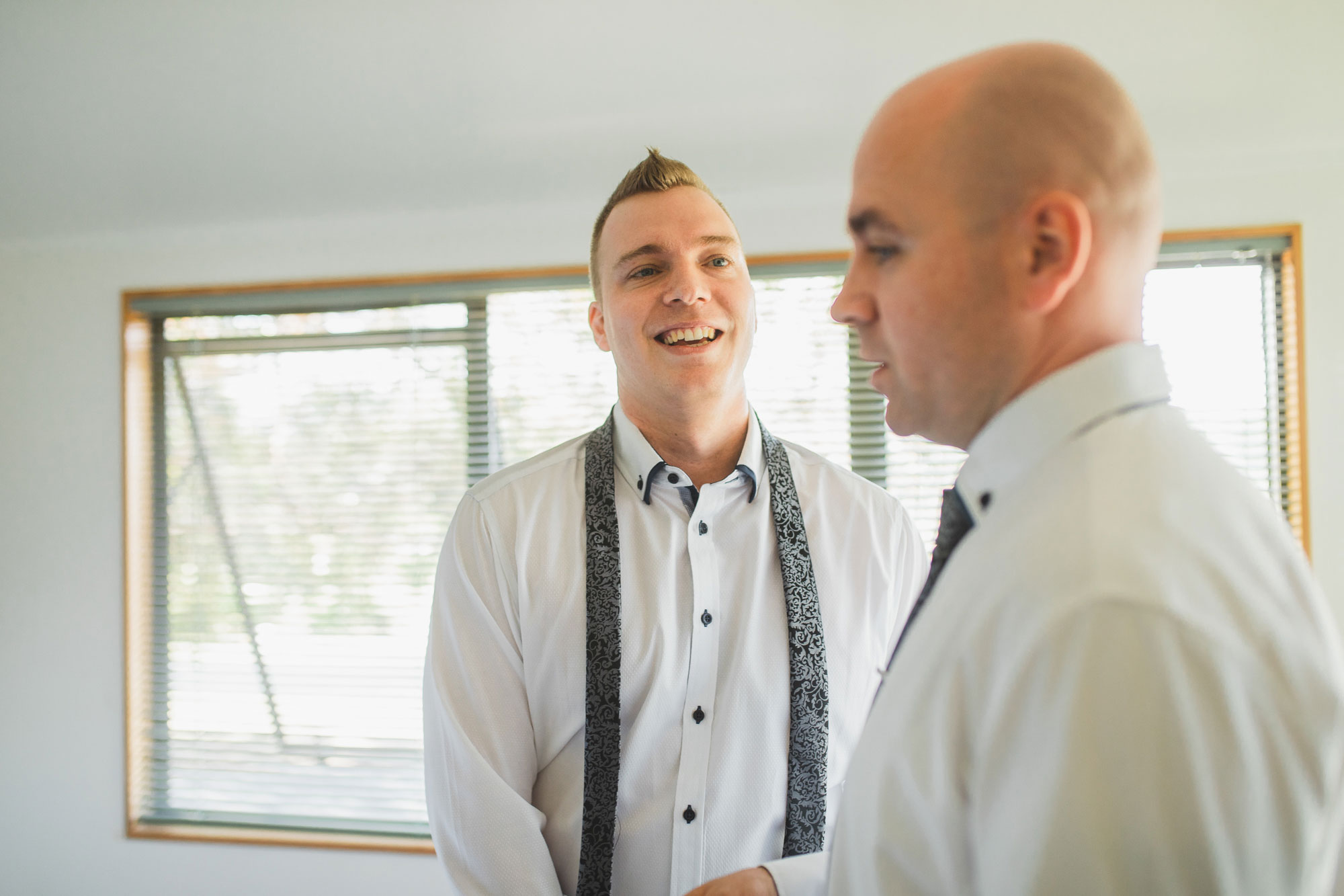 auckland wedding groomsman laughing