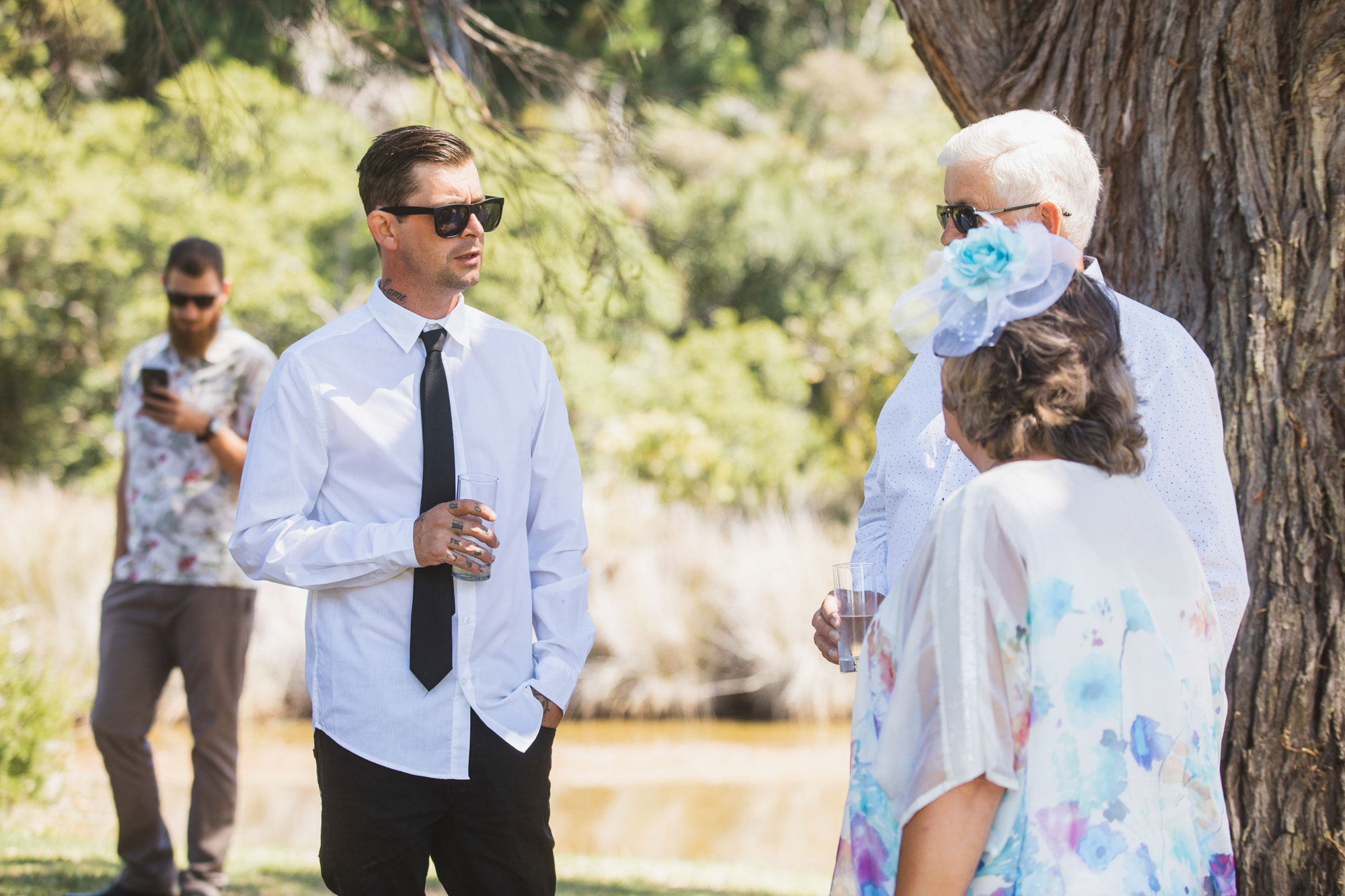 auckland tawharanui lodge wedding guests chatting