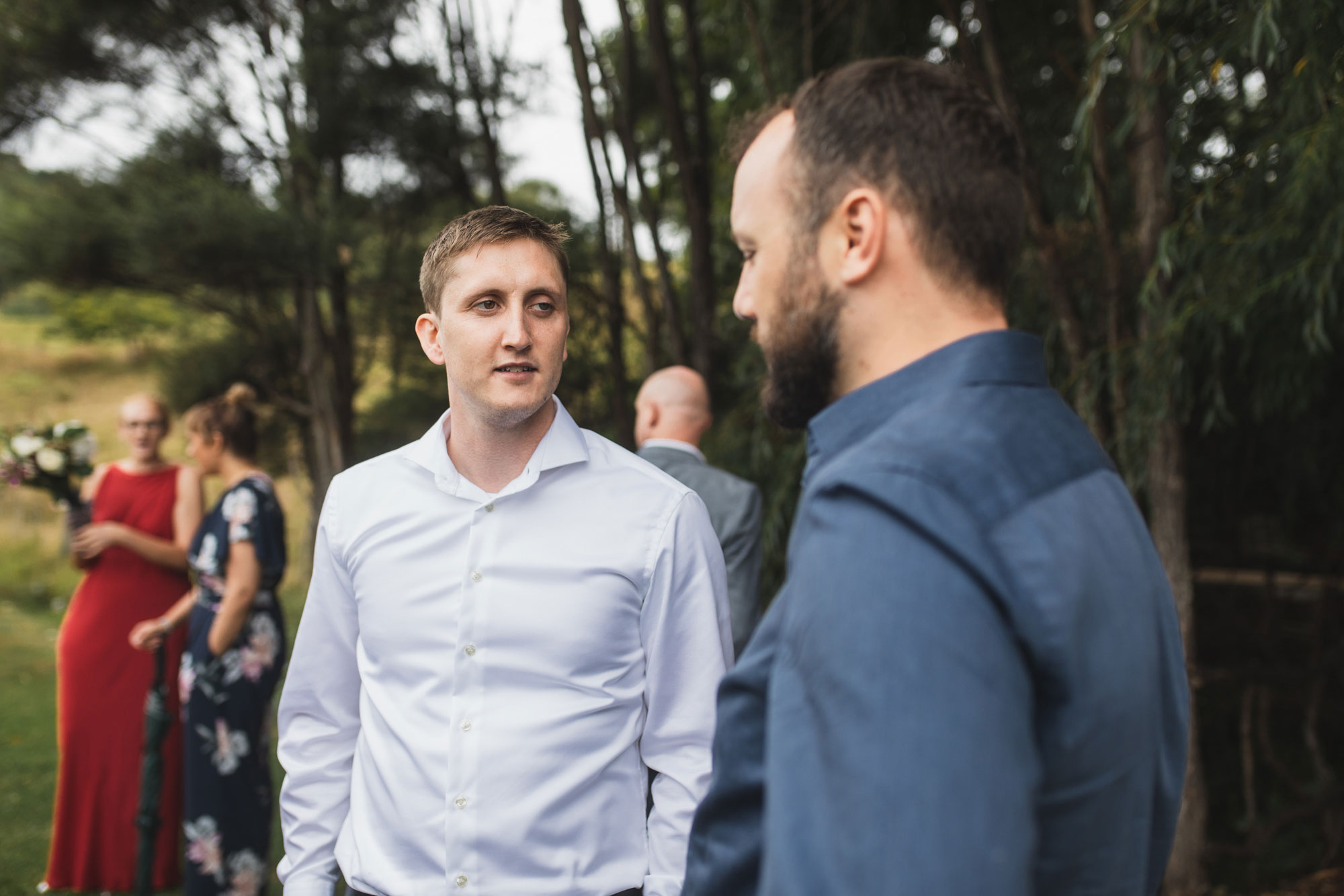 auckland waterfall farm wedding guest chatting