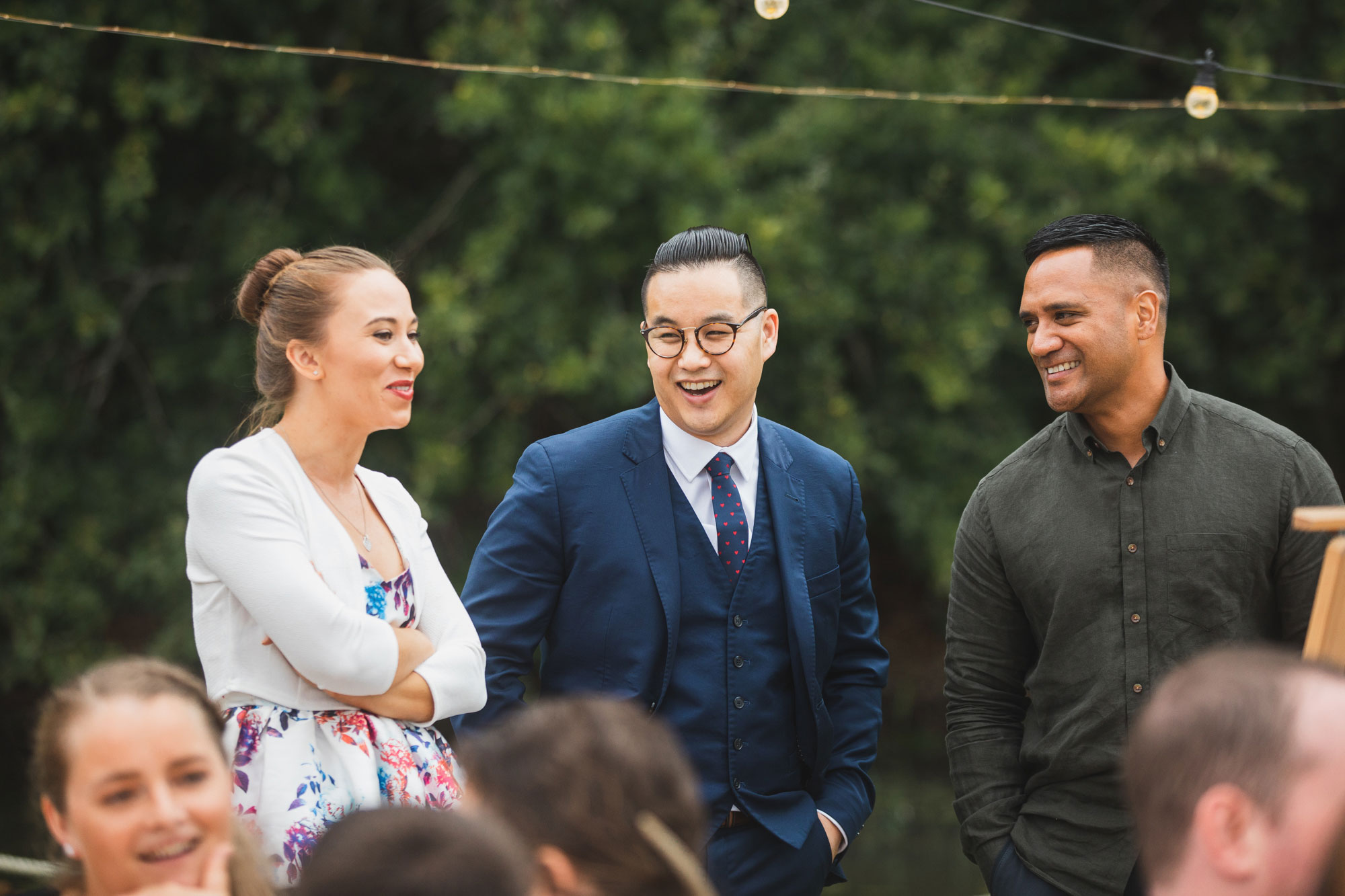 auckland waterfall farm wedding groomsmen talking