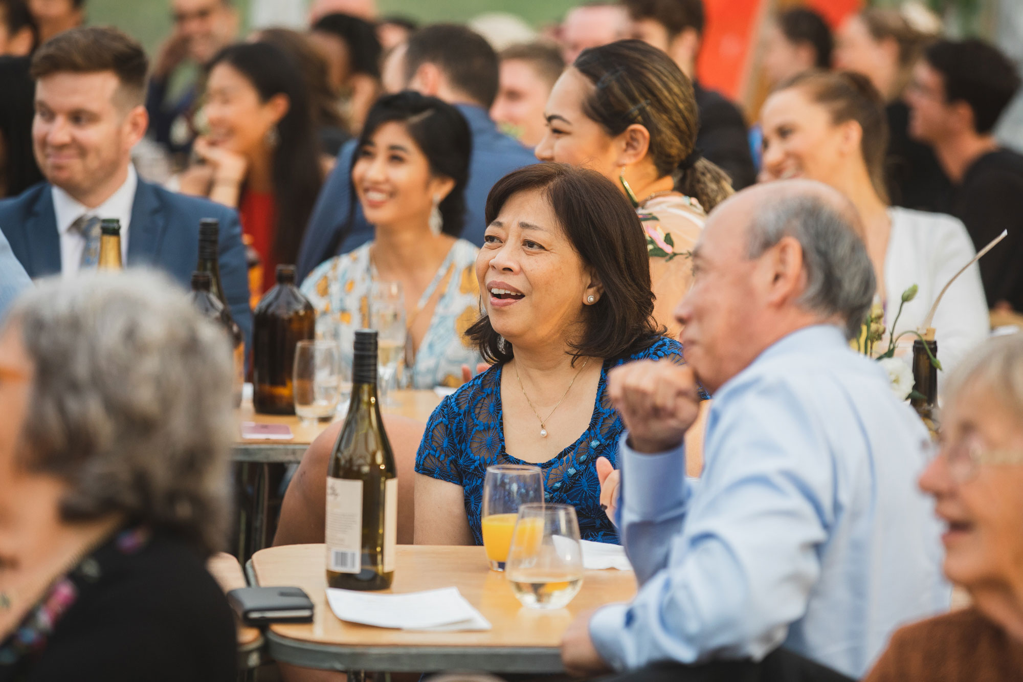 wedding guests laughing