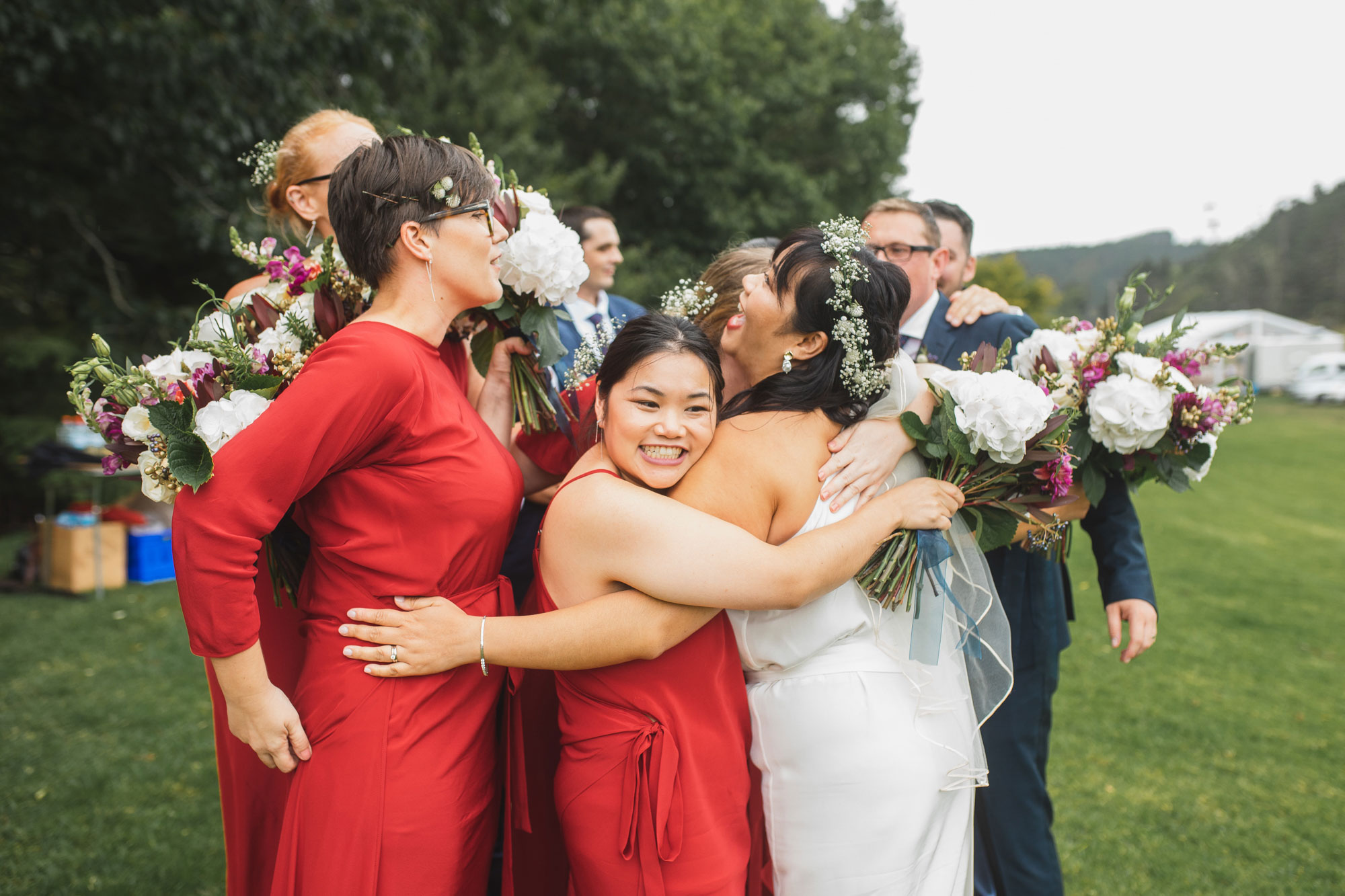 auckland waterfall farm wedding bridal party hug