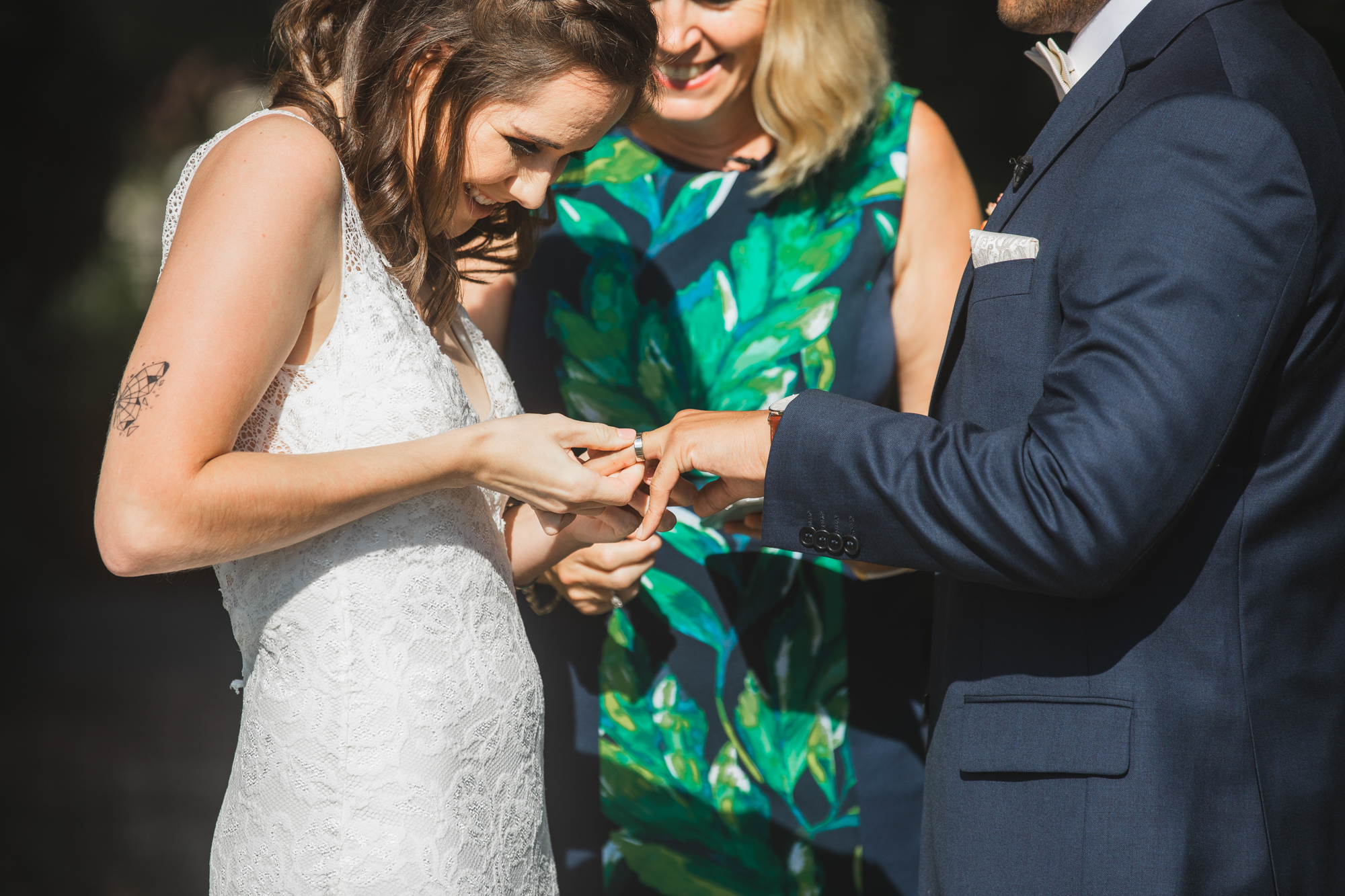 bride putting on ring