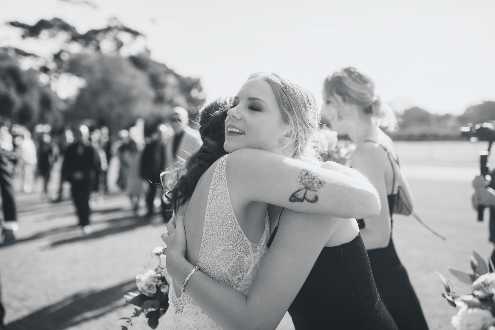 wedding guests hug