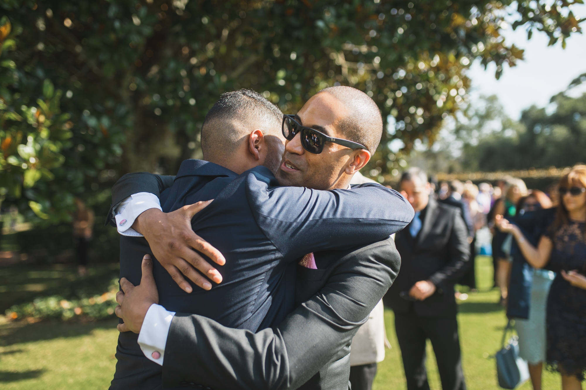 guest hugging groom
