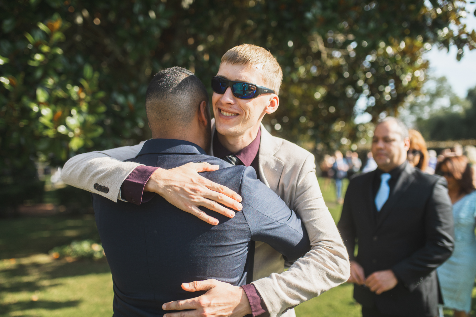 guest embracing groom
