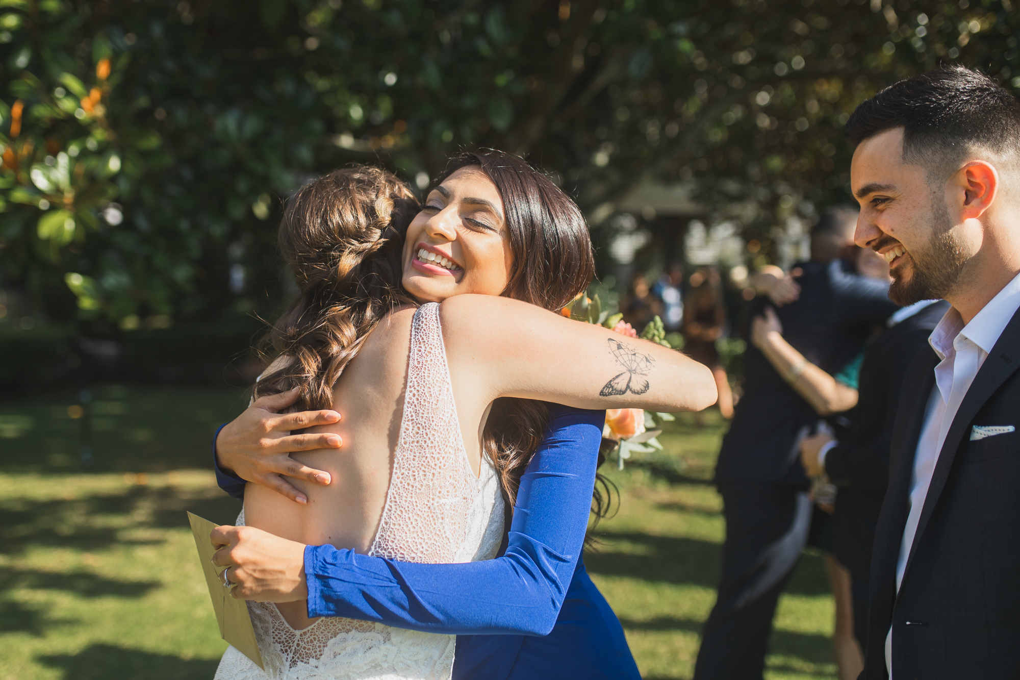 guest hugging bride