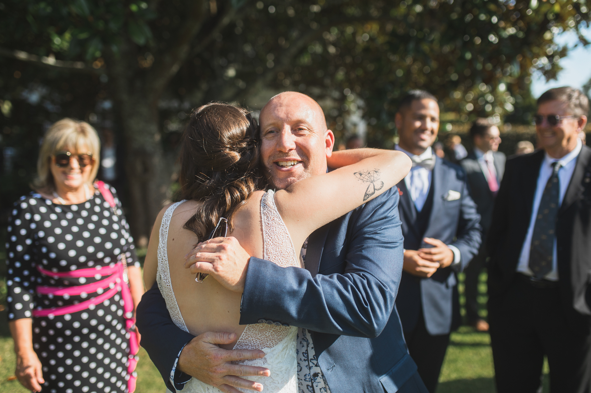 guest hugging the bride