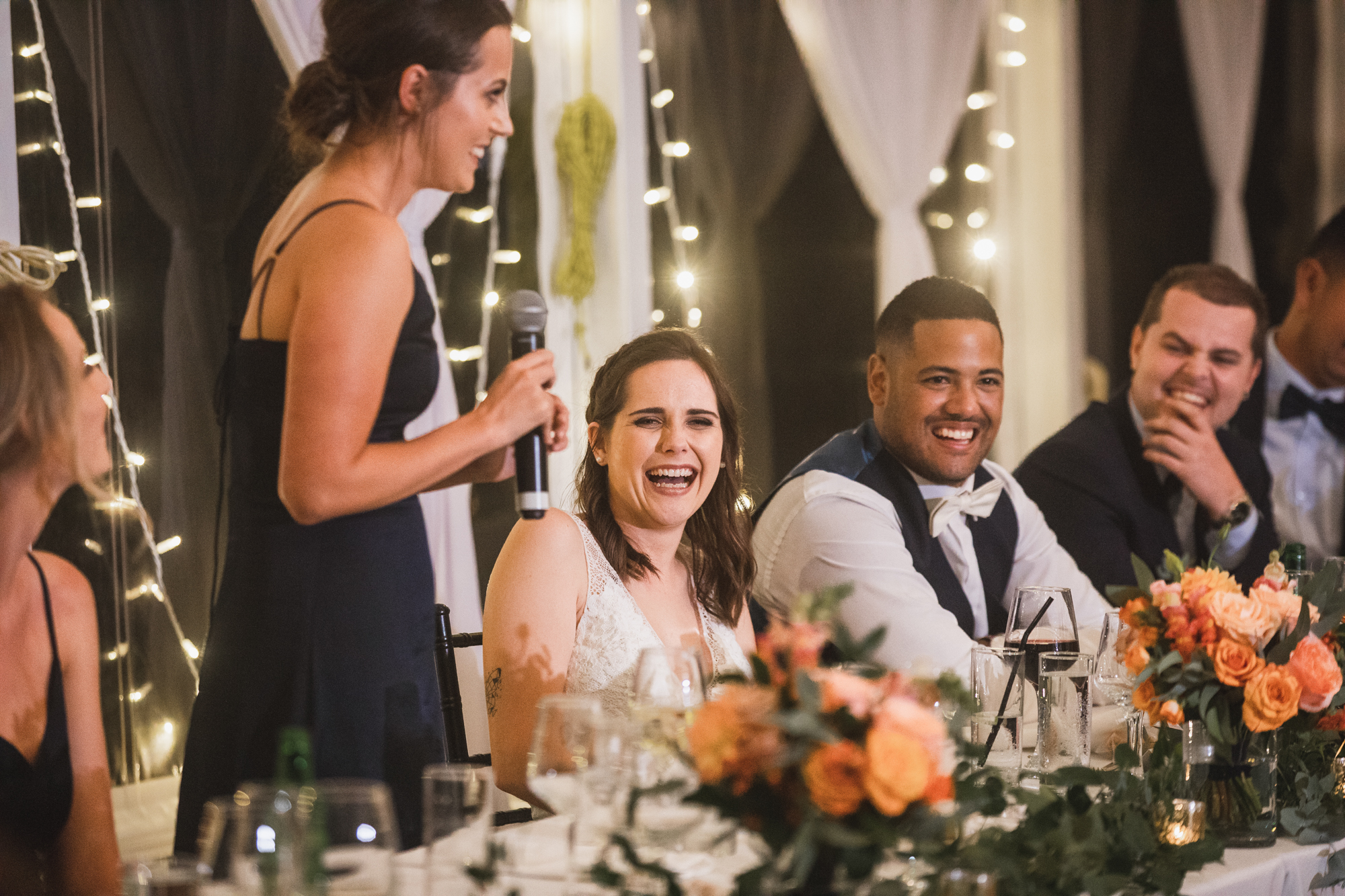 bride and groom laughing