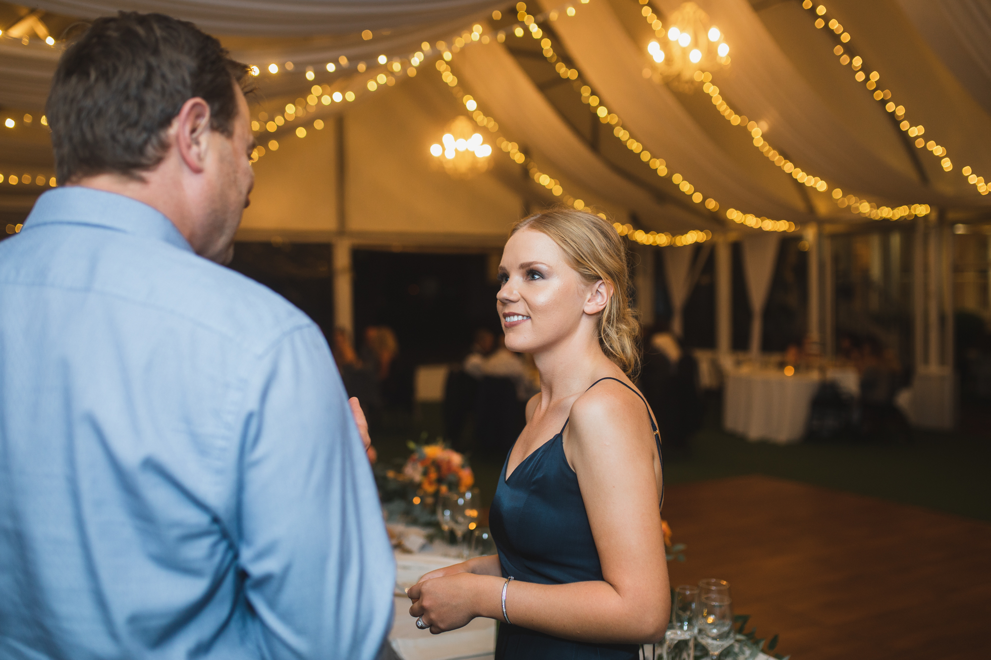 wedding guests chatting at reception