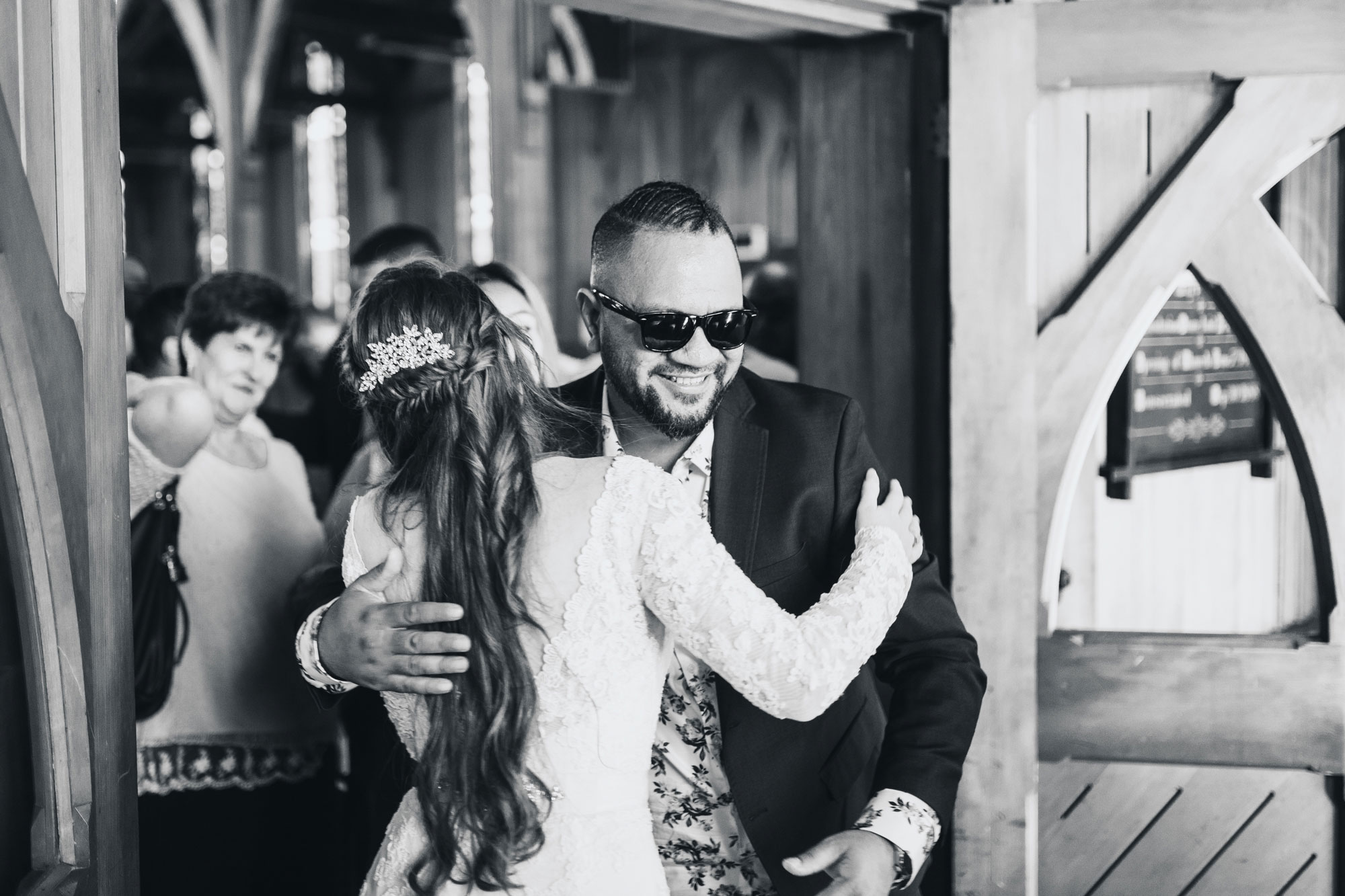 guest hugging bride