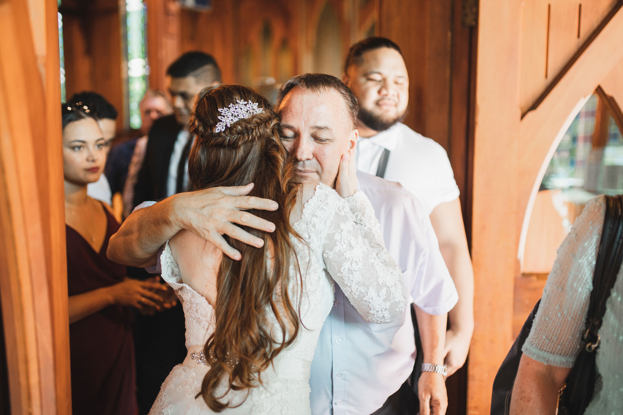 wedding guest hugging bride