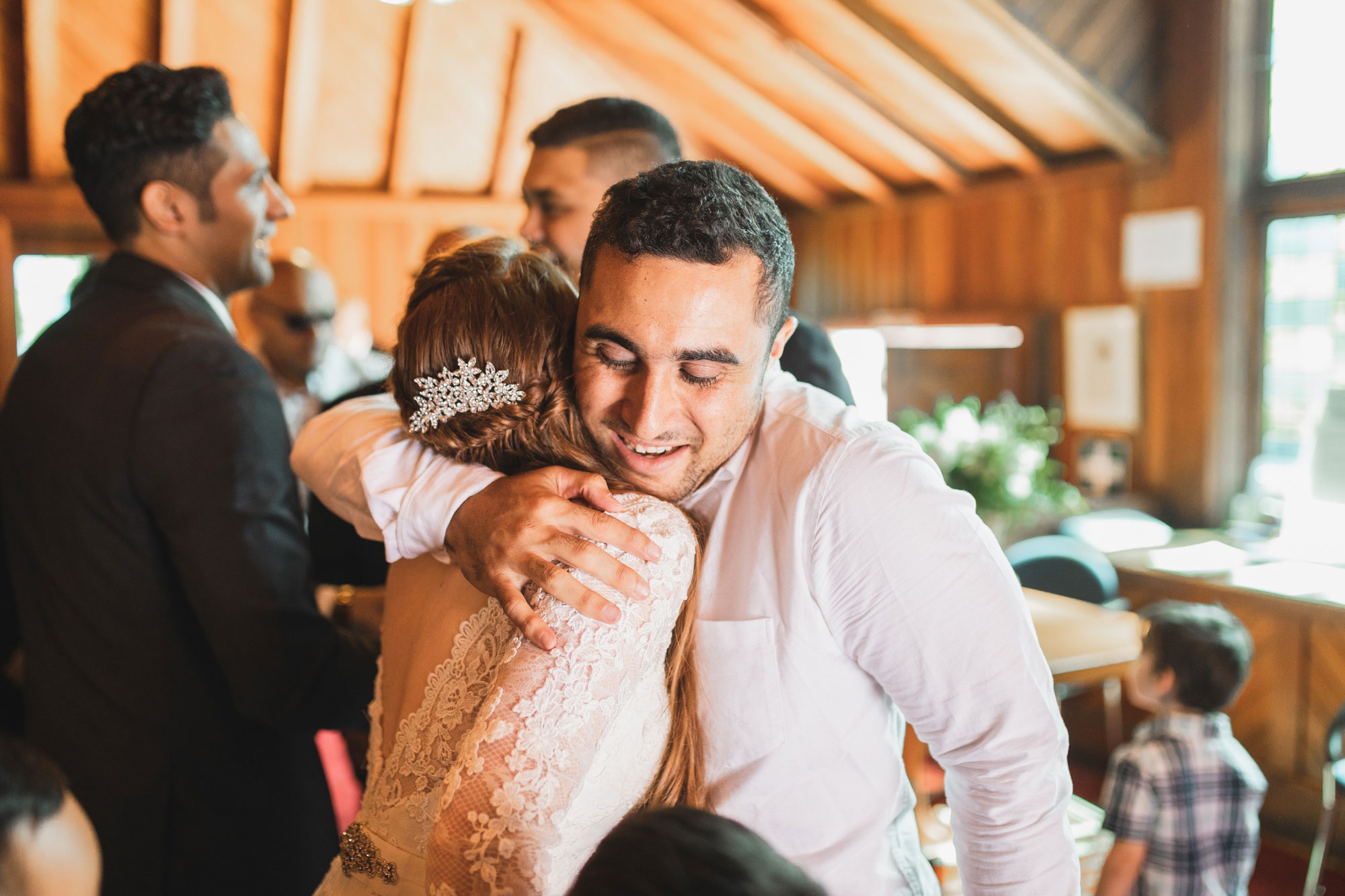 wedding guest hugging bride