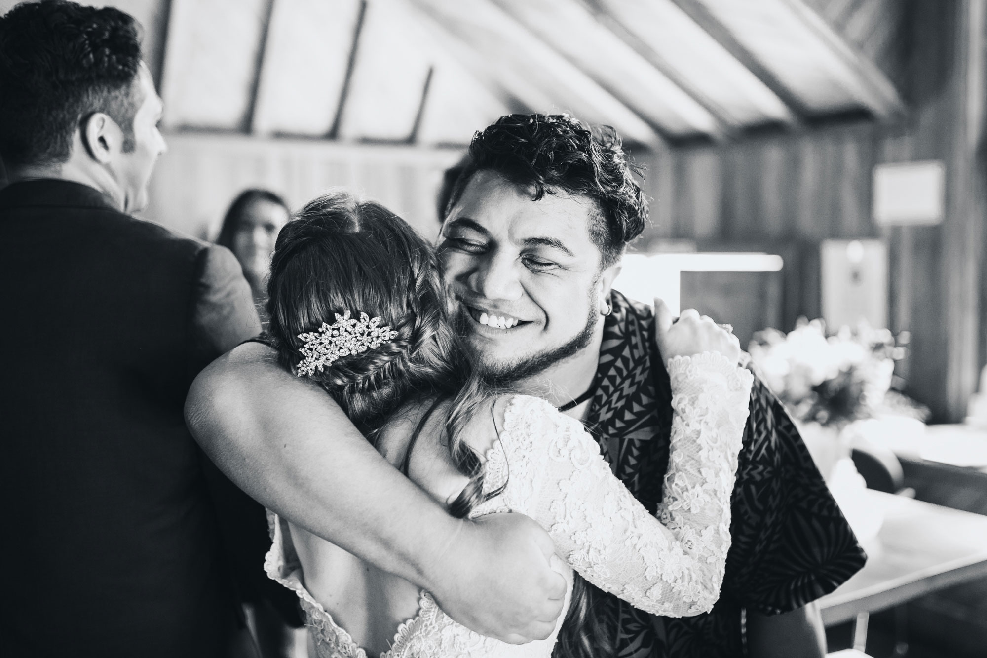 wedding guest embracing bride