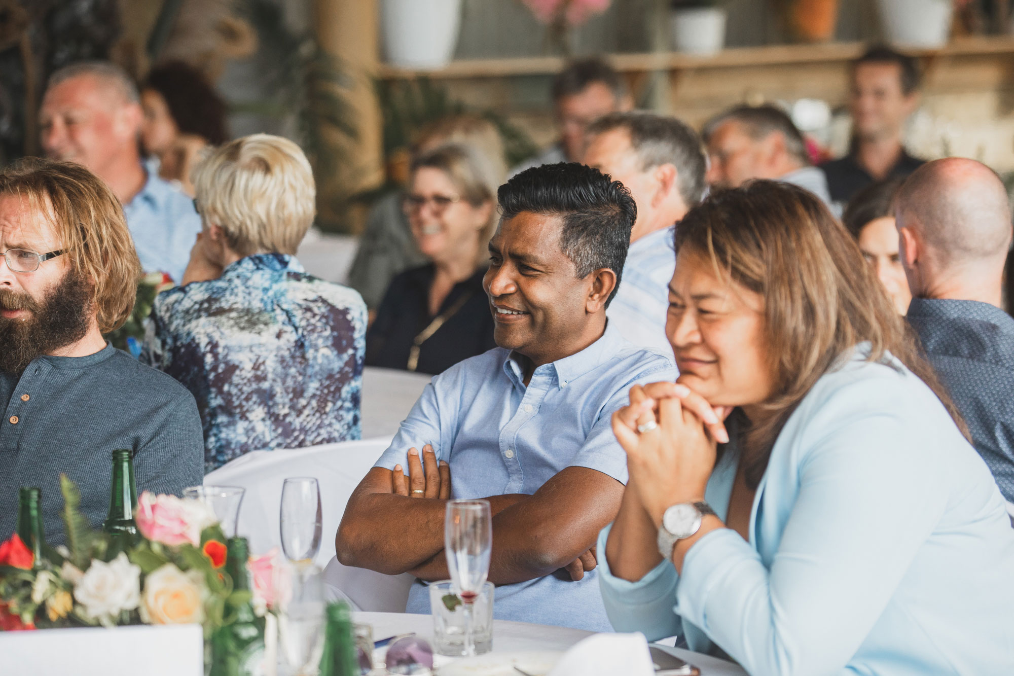 wedding guests having a good time at bethells beach cottages