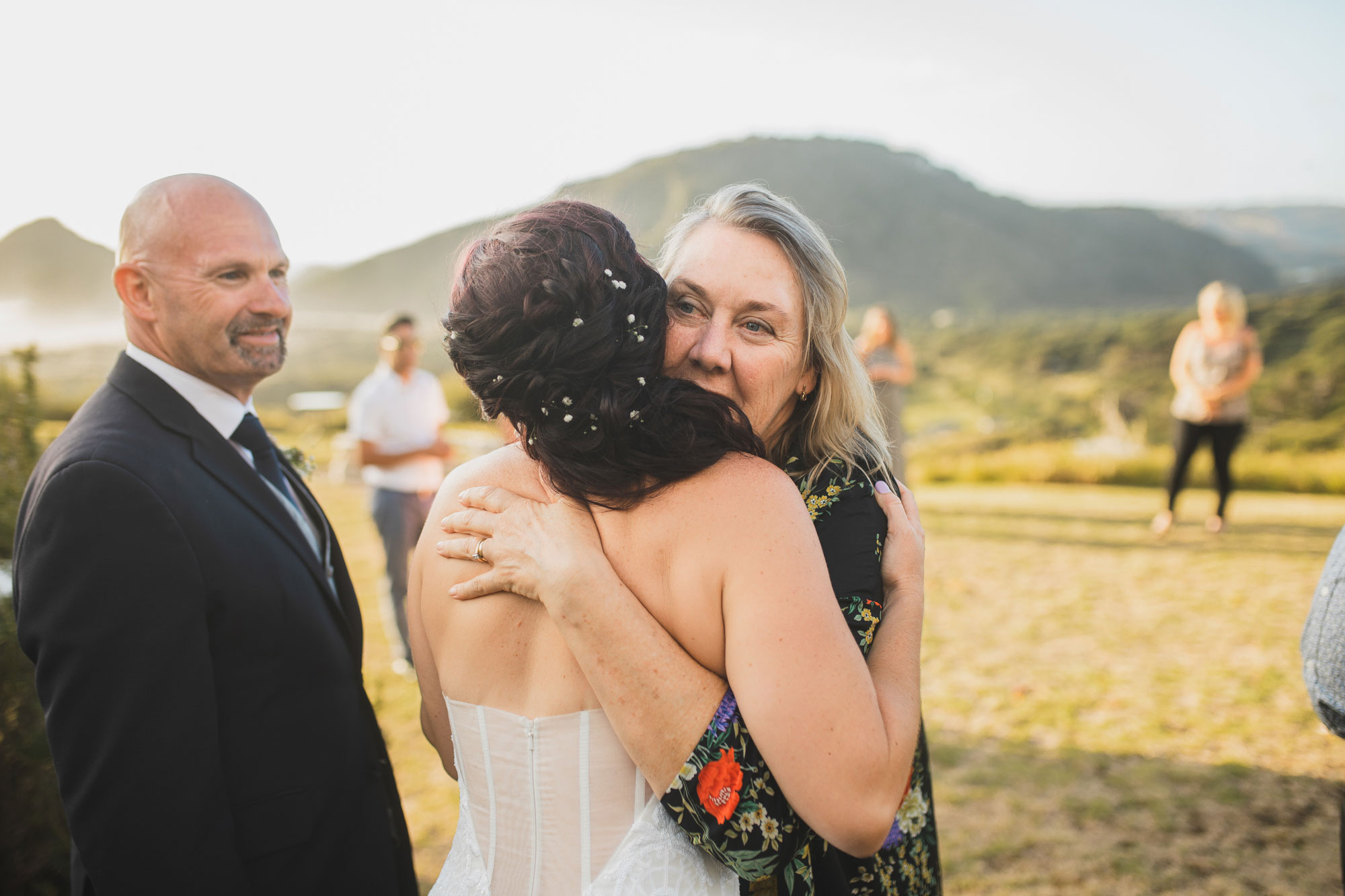 wedding guests congratulating bride