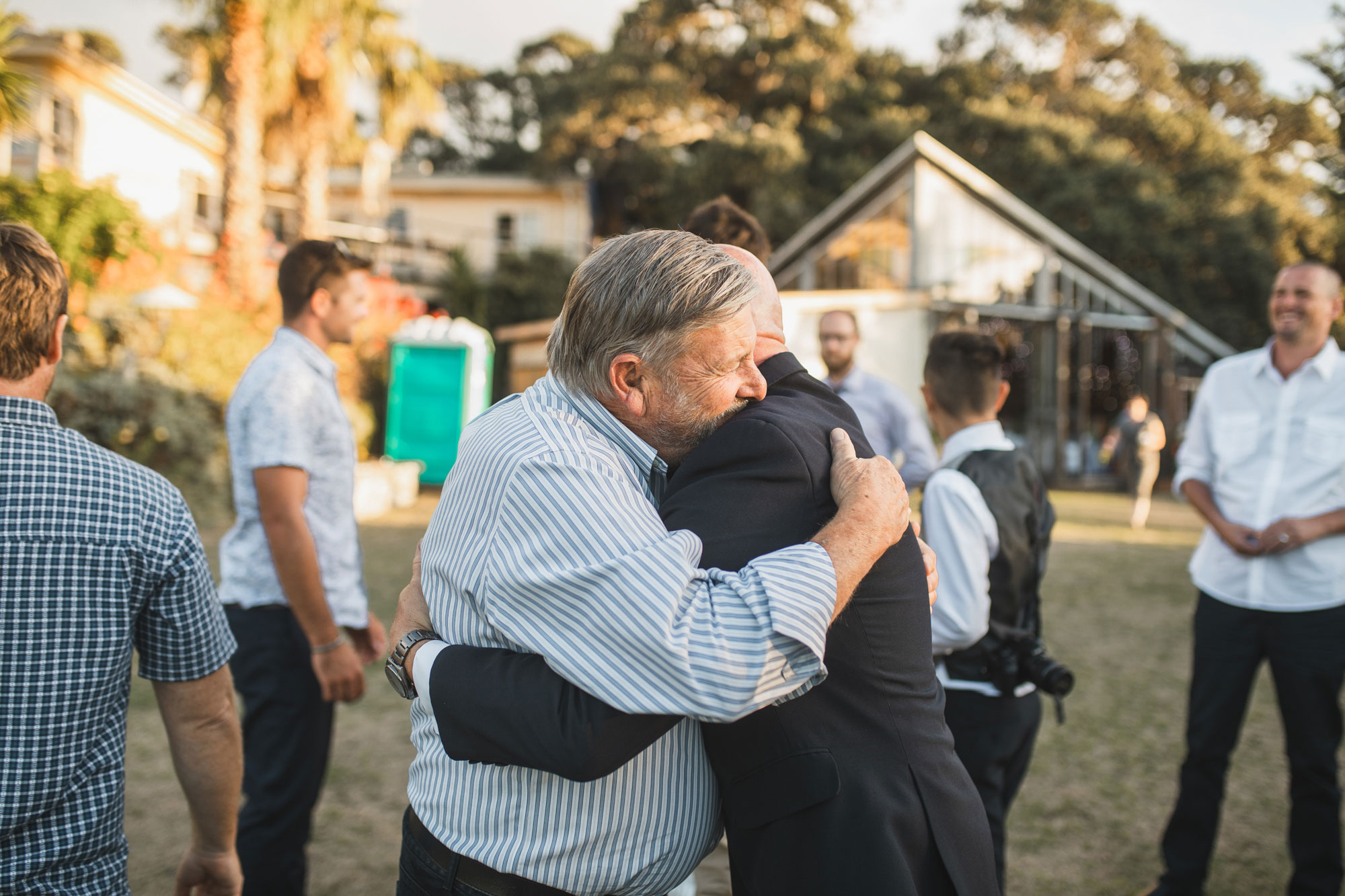 wedding guest hugging